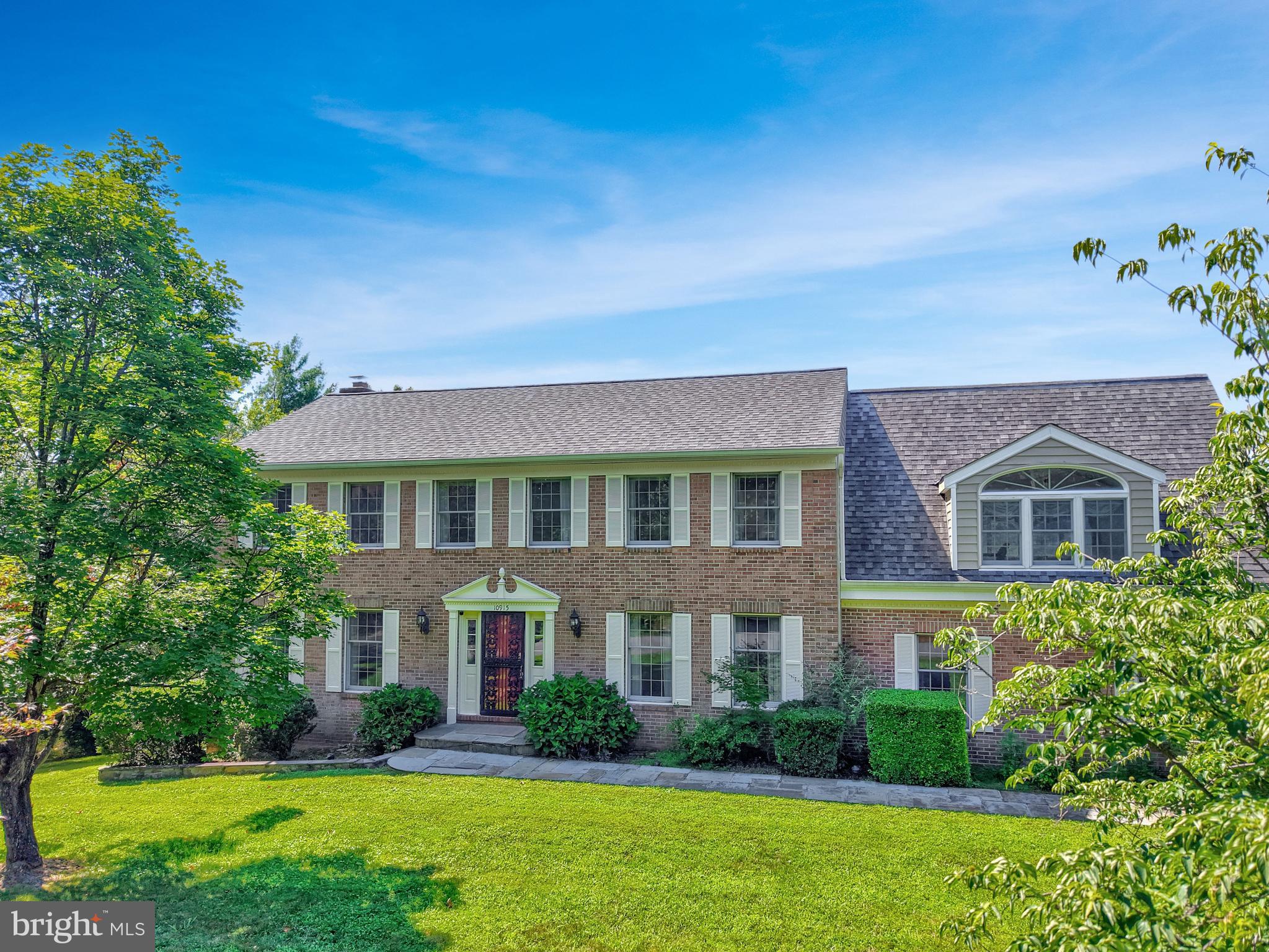 Welcome home to a place where space, privacy, and timeless comfort come together in one of Great Falls' most desirable settings. Nestled on just over 2 pristine acres at the end of a quiet cul-de-sac and located within the highly sought-after Langley High School district, this exceptional property offers the perfect balance of peaceful seclusion and everyday convenience, just minutes from Georgetown Pike, Tysons Corner, and the scenic parks along the Potomac River. Picture mornings with coffee or evenings spent unwinding on the screened porch, where peaceful views overlook a beautifully landscaped, level backyard—an ideal setting for entertaining, outdoor games, gardening, or simply enjoying the tranquility of your own private retreat. Inside, the generous floor plan offers flexibility for today's lifestyle, while a unique bedroom suite above the garage features its own private entrance through the garage and separate rear staircase, making it perfectly suited for multigenerational living, long-term guests, a private home office, or an inspiring creative space. The stunning gourmet kitchen features a Viking Professional oven, Bosch dishwasher, abundant storage and functionality, and an oversized island for seamless entertaining. The expansive walkout lower level includes a bedroom, full bath, and kitchenette, creating an ideal space for extended family, guests, or true multigenerational living. Thoughtfully designed with room to gather, room to grow, and room to make lasting memories, this exceptional Great Falls home is further enhanced by valuable updates, including a roof, insulated siding, and gutters replaced in 2018, along with a whole-home water filtration system installed in 2022, offering added peace of mind for years to come.