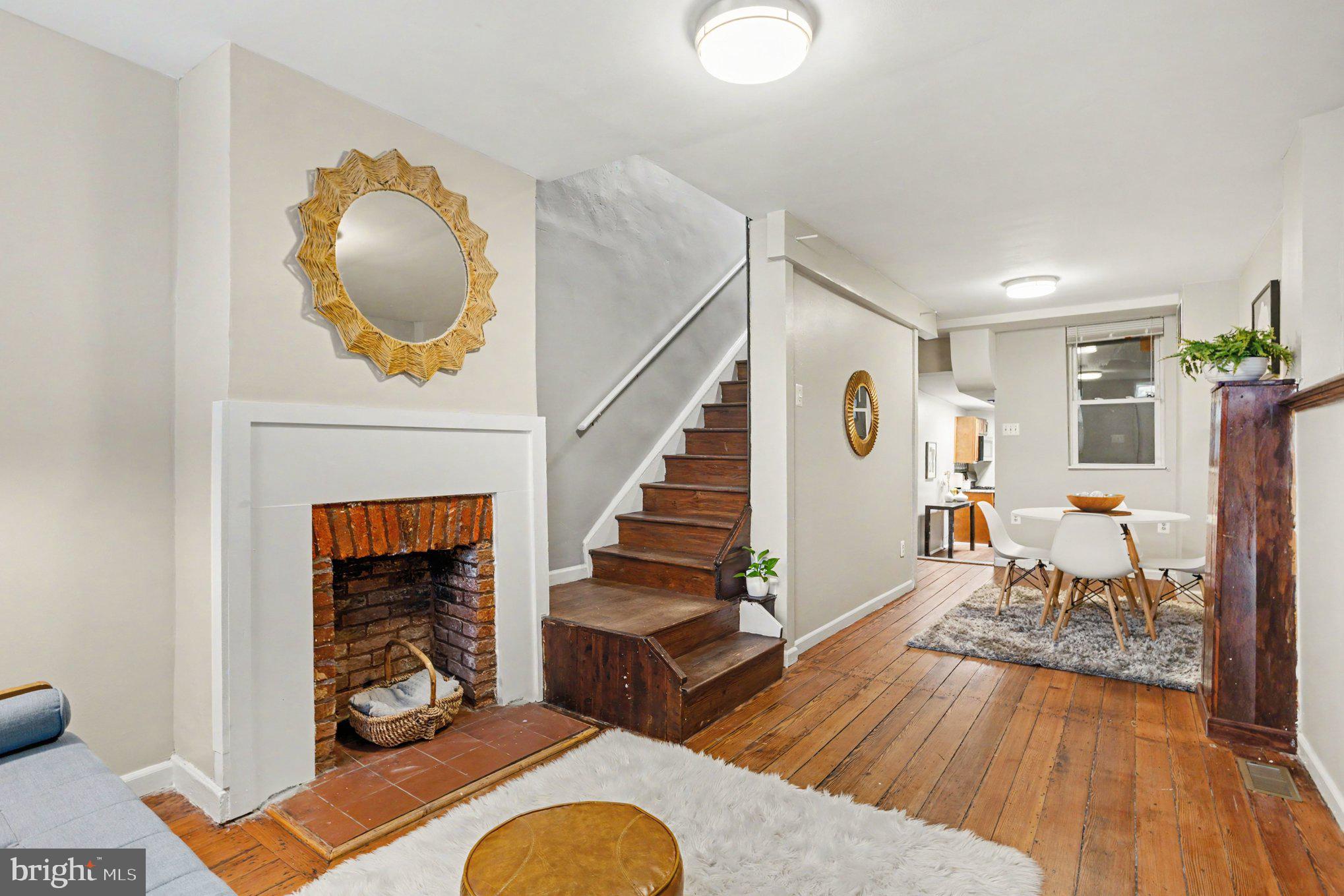 Timeless Charm Meets Flexible Living

This inviting brick rowhome is filled with character and warmth, featuring 2 bedrooms, a spacious loft, a versatile den, and 1 full bath. Rich original hardwood floors, exposed brick, and exposed wood beams blend seamlessly with thoughtful updates, creating a home that is both charming and functional.

The welcoming living and dining areas showcase an original decorative fireplace, adding historic appeal and a cozy focal point for gathering with family and friends. The kitchen flows into a convenient mudroom, providing extra storage and everyday practicality, with direct access to a lovely private courtyard—perfect for morning coffee, container gardening, or outdoor entertaining.

Upstairs, you'll find a large bonus room ideal as a family room, gaming room, home office, or creative space, offering the flexibility today's buyers are looking for. The loft provides even more options for guests, hobbies, or additional living space.

Packed with architectural details and timeless charm, this home offers a unique opportunity to enjoy historic character with the versatility to fit your lifestyle.