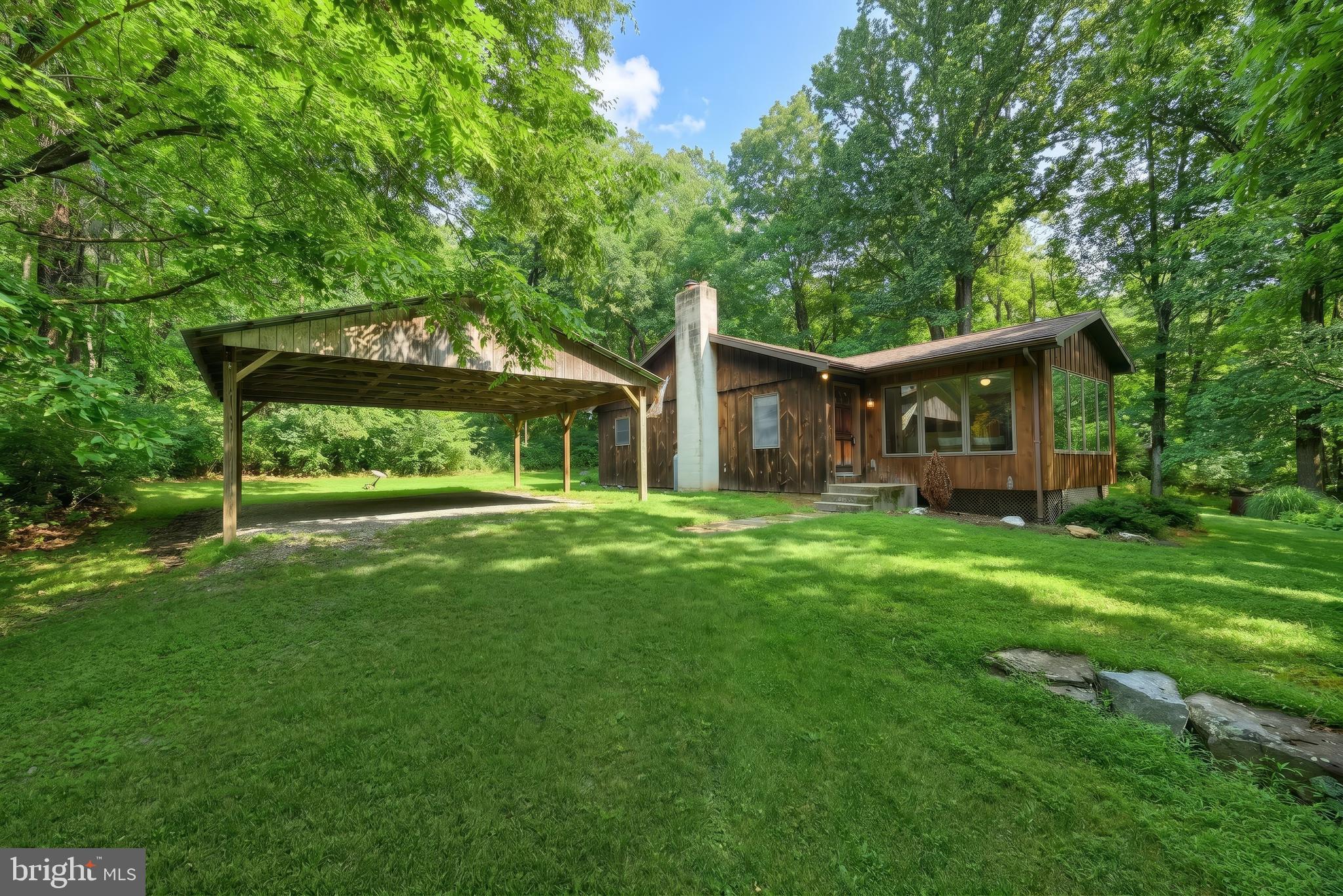 Escape to your own private retreat on 49.5 picturesque acres of rolling countryside teaming with wildlife. This secluded ranch home offers the perfect blend of privacy and convenience, featuring 2 bedrooms, 2 full baths, a bright 3-season room, main-level laundry, a spacious carport and a detached garage. Outdoor enthusiasts will love the property’s proximity to Liberty Mountain Resort, historic Gettysburg, Caledonia State Park, and the 85,000-acre Michaux State Forest, providing year-round opportunities for hiking, skiing, fishing, and exploring. The property is enrolled in the Clean & Green program, offering reduced real estate taxes while preserving its natural beauty. Whether you’re seeking a peaceful full-time residence, a weekend getaway, or recreational land with exceptional views and abundant wildlife, this unique property is a rare opportunity.