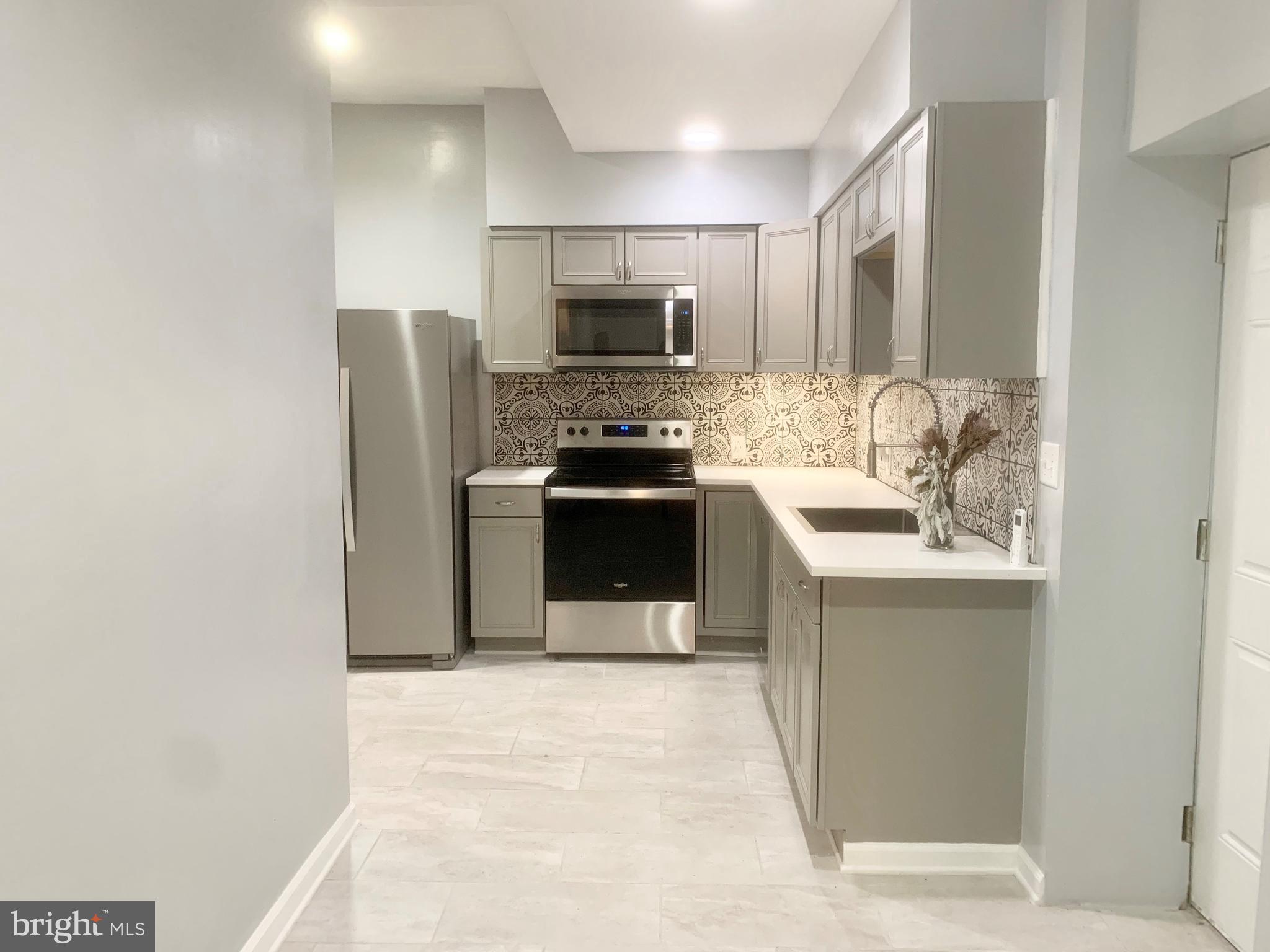 2 bedrooms, 2 bathroom apartment with a great location and TWO Private entrances.

Updated throughout, with a recently renovated master bathroom and kitchen with stainless steel appliances, dishwasher, garbage disposal,. Both bedrooms are large with plenty of closet space.

This unit features hardwood flooring throughout, central A/C and a small outdoor private space in the rear.

Centrally located, 1/2 a block from Broad and Ellsworth, the subway station, nearby Target, Starbucks, Sprouts and the brand new Giant! Available 4/15.