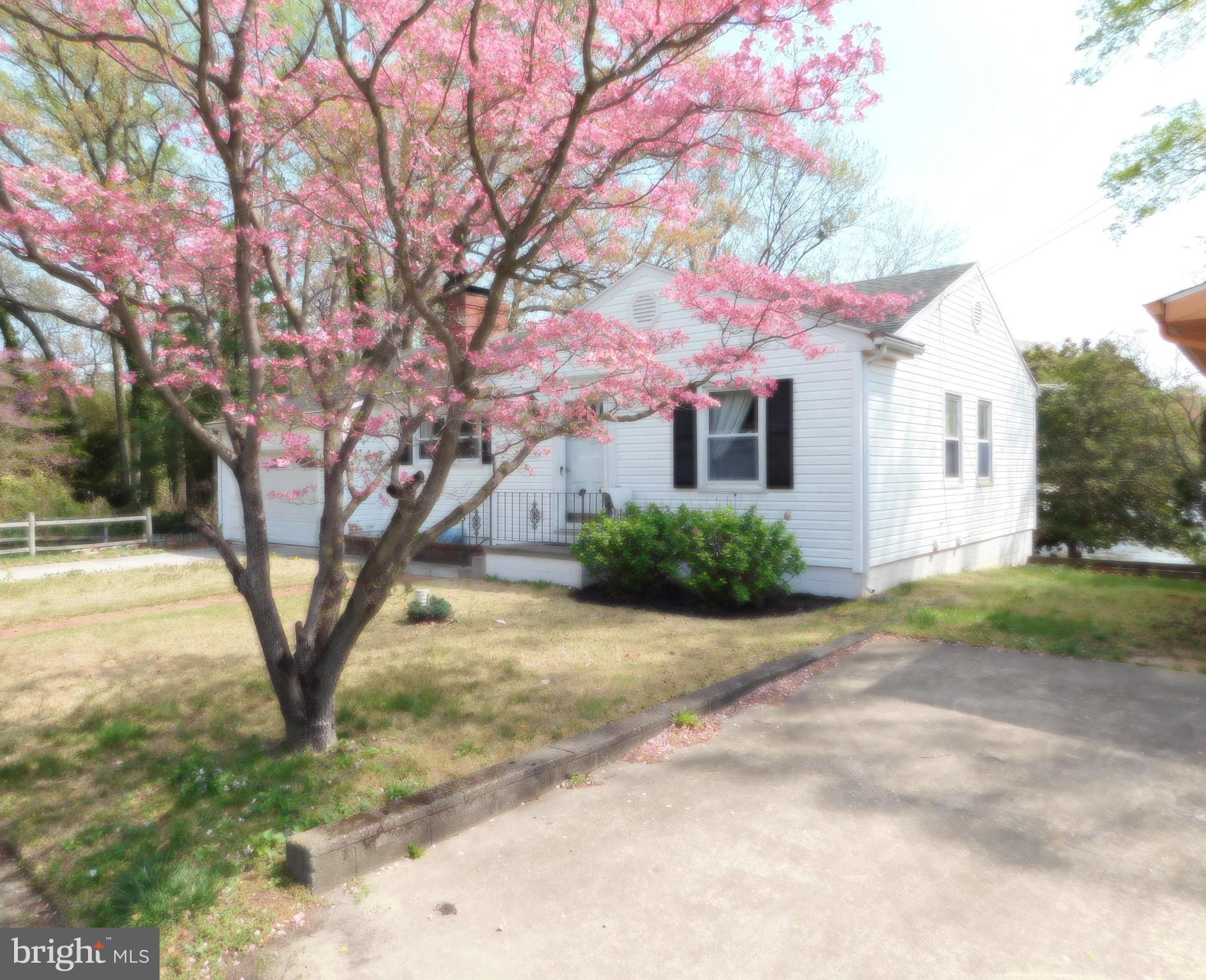 BACK ON THE MARKET DUE TO BUYER'S FINANCING!  $10,000 PRICE IMPROVEMENT.  Warm weather is fast approaching and with so many upgrades and curb appeal, all found within this prime location, this wonderful home creates an incredible opportunity to move your family in quickly to a parklike setting and begin creating lasting memories. Easily accessible to casinos, shopping, restaurants, schools, parks, hospitals and 45 minutes to Lewes & Rehoboth Outlets and Beaches.  Waiting patiently just for you is this meticulously maintained and upgraded home sits right on Moore's Lake offering unobstructed views  at the end of a quiet dead end street, where your waterfront oasis sits peacefully and very private setting just outside of The city (so no city taxes) but offering all of the amenities found within The City.  Situated within the highly sought after Caesar Rodney School district this 3 bedroom 2 bath home is literally right around the corner from shopping and 5 minutes from Dover Air Force Base (DAFB).  Walking into the foyer and stepping to the left you will find yourself in an expansive Living and Dining Room Area complete with a brick fireplace, built-ins and beautifully refinished original hardwood flooring.  Catch your breath as you look through the large picture window at your incredible lake view overlooking the beautiful lake!  The kitchen is to the left including yet another built-in corner curio cabinet and an access door leading into the attached garage complete with a handicapped ramp  At the other end of the house you will find 2 large bedrooms, a full bath and tons of closet space for ample storage.  Proceeding down the steps to the lower living level you will find an enormous family Room with a beautiful stone fireplace and insert.  On this level there is also an office with wonderful built-in cabinetry, a third bedroom full bath and basement area.  The rear of the home is exposed to the lake with multiple windows so you can enjoy the wildlife, a walkout leading to a wonderfully sculptured brick patio, lake front yard and of course the beautiful lake.  The home includes a maintenance free exterior, newer double hung replacement windows, well, new central air, new electric hot water heater and new roof.  Cast your boat or Kayak directly from your yard for fishing and total enjoyment of the tranquility that this waterfront home offers.  Call to schedule your private tour of this wonderful property today.