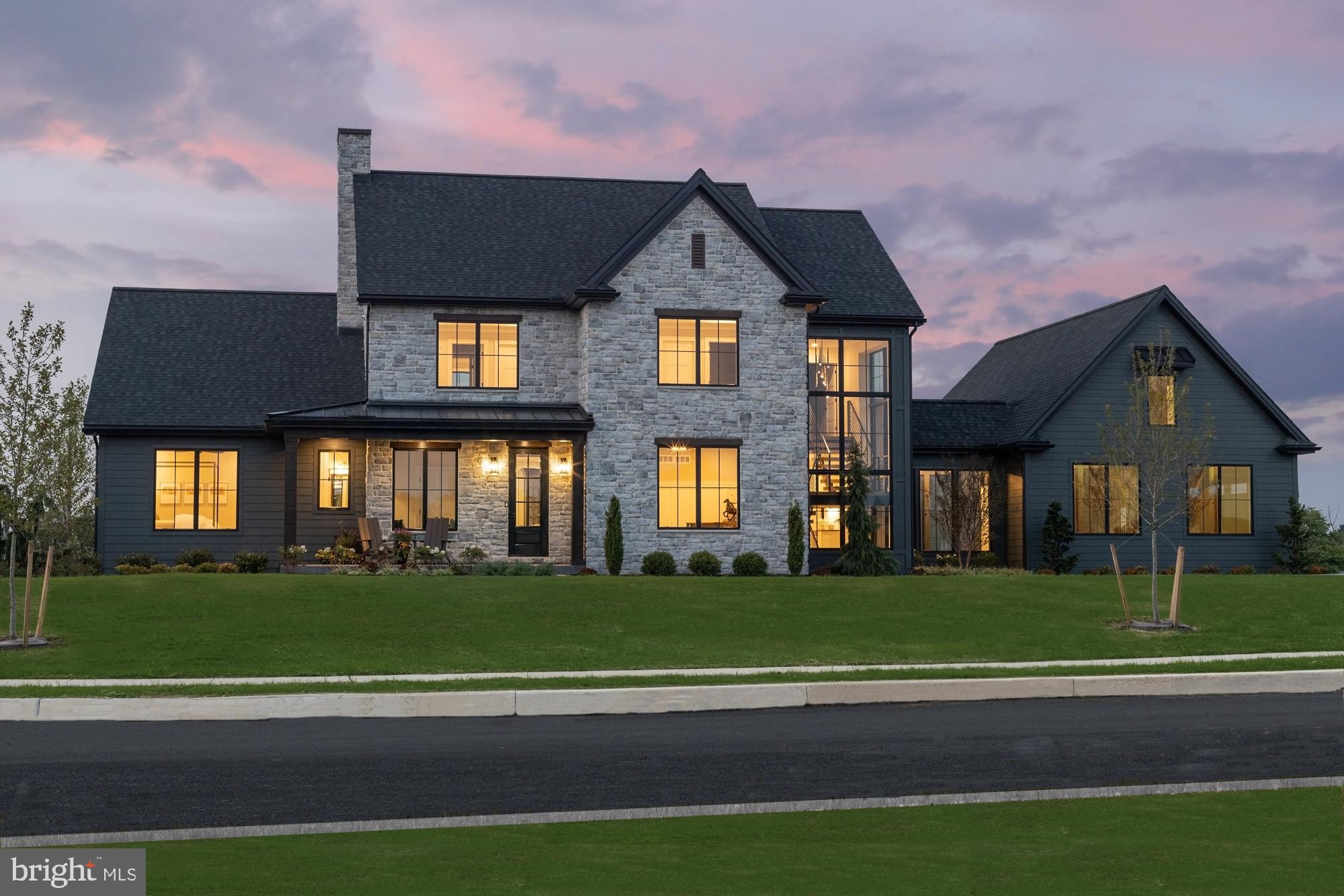 Come see the Roland Builder Inc model featured in the Harrisburg Parade of Homes. Roland Builder's custom floor plan with the most up-to-date features and amenities representing the very best quality and craftsmanship clients have come to expect from Roland Builder, Inc. This home has over 5,000 square feet of luxury with 5 Bedrooms, 5 1/2 Baths, 3-car garage and is positioned to maximize gorgeous views of the surrounding valley and golf course. Discover the abundance of luxury as you walk onto the front porch and for the first time walk into the foyer. To the right is the study perfect for anyone working from home with custom built-ins and a large walk-in closet with wainscoting.  To the left is the guest suite with full bath and walk in closet.  Once out of the Foyer you will enter the dining room and kitchen which leads to the luxurious great room which has an abundance of windows from floor to ceiling giving you endless amounts of natural light.  The floor to ceiling stone fireplace is a focal point all the way up to the cathedral ceiling.  The Custom appointment ship and superb detail alone is eye catching and evident through-out.  Enjoy the 1st floor living at its finest w/modern open floor plan featuring the custom kitchen with hardwood flooring, high-end appliances, walk-in pantry and a large island for entertaining.  Attached to the kitchen is the oversized mudroom featuring a walk-in closet, half bath, and lockers with cubbies for coats, hats and backpacks. The modern staircase is also located in the mudroom and features custom iron railing, open risers and a wall of stone, 3-stories.  At the top of the steps is the 2nd floor laundry room conveniently positioned just outside the bedrooms.  The Owners Suite features a tray ceiling, 2 walk in closets, and Owners bathroom with Pedestal tub, walk-in ceramic shower,  and double sinks.  The 2nd & 3rd bedrooms each having their own tray ceiling, walk-in-closet and full bath.  The lower level is also finished with an additional 1,500 sq feet of livable space having a family room, full bath and 5th bedroom. Other features include:   ½” engineered, white oak flooring, stone flooring and porcelain tile, dual zone HVAC, oversized 3-car garage with unfinished bonus room over garage with stair access, central vacuum system and under-floor heating in the breezeway. You will truly love entertaining and welcoming your guests to your fabulous home.  And YES, must see to truly appreciate.