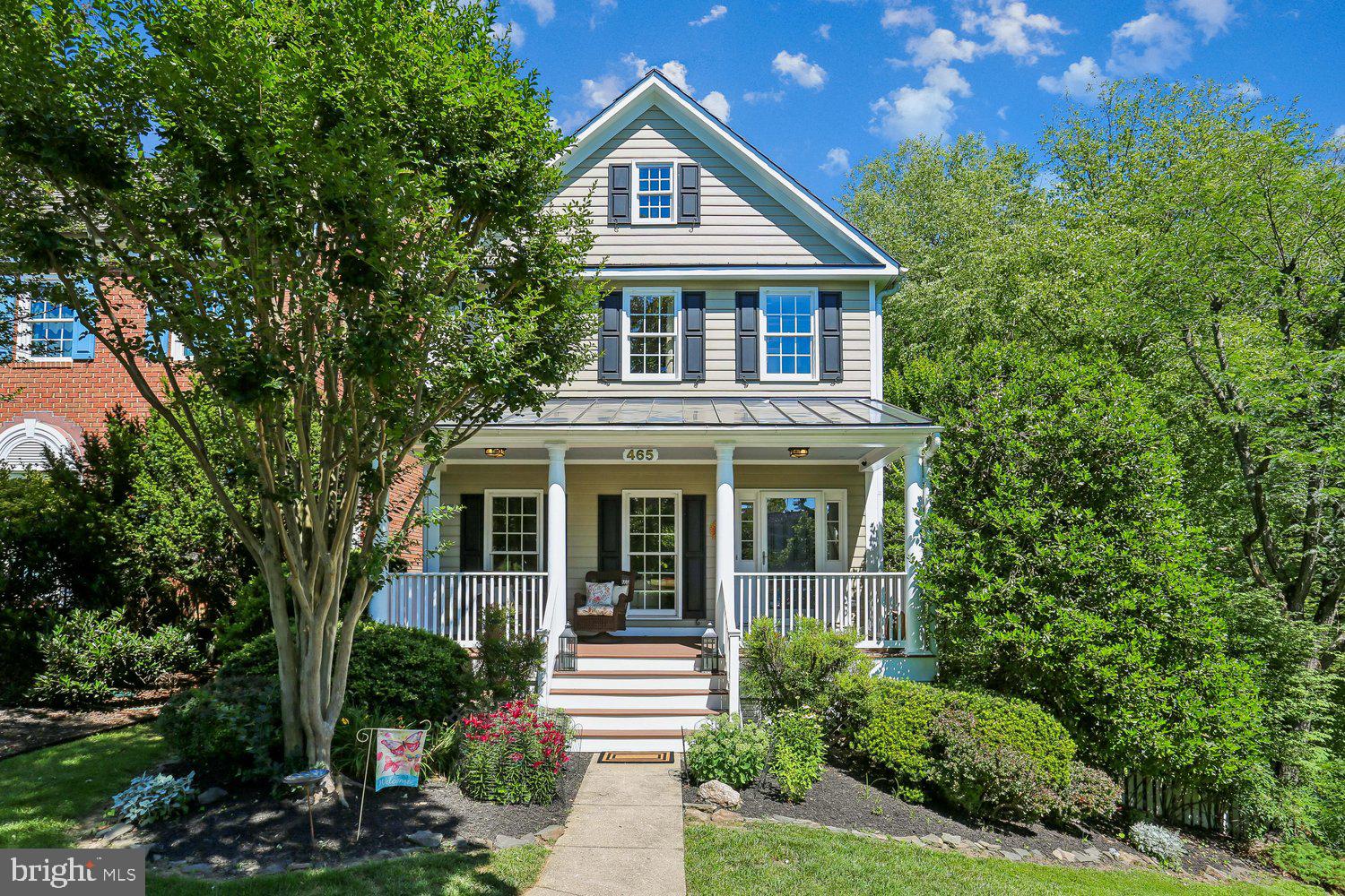 Beautifully updated home featuring spacious, light-filled interior, inviting outdoor spaces, and an exceptional location. Inside, hardwood floors extend throughout the main level, where an open floor plan is perfect for for entertaining. The spacious living room transitions seamlessly into the updated open-concept kitchen and family room. The kitchen features a central island,  stainless steel appliances, including a new refrigerator and dishwasher, decorator lighting, and abundant cabinet and counter space. Open to the kitchen, the family room is highlighted by a fireplace and views of the surrounding landscape. A conveniently located powder room completes the main level. Hardwood flooring continues throughout the upper level, where the expansive primary suite offers a large walk-in closet and a beautifully appointed en-suite bath featuring a dual-sink vanity, soaking tub, glass-enclosed shower, and decorator tile flooring. Two additional bright bedrooms each include double-door closets and share a full hall bath. The finished lower level offers outstanding flexibility with a large recreation room, an oversized bonus room, abundant closet space, and a full bath, providing options for a media room, fitness area, playroom, guest space, or home office. Outdoor spaces are equally inviting. The wraparound deck and newly landscaped slate patio provide wonderful settings for relaxing, dining, and entertaining while enjoying the peaceful natural surroundings. Additional improvements include a new roof (2026), water heater and air conditioning system (2018). Set in a phenomenal location with Kentlands recreation complex right outside your front door, this home also offers close proximity to neighborhood lakes and walking paths, Rachel Carson Elementary School, and the countless dining, shopping, and entertainment options as wnell as to I270, the ICC, and the Metro.