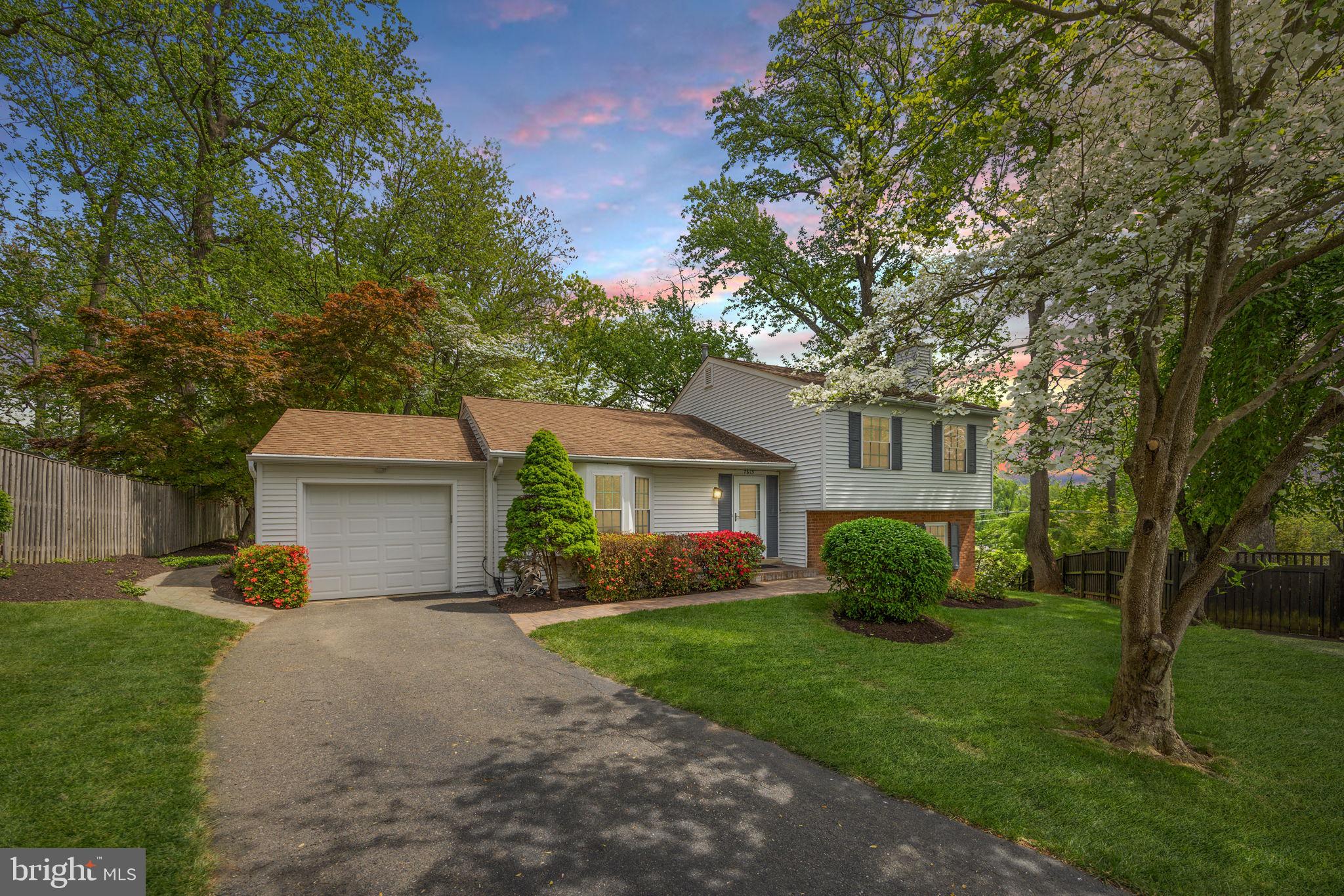 FALLS CHURCH — Sunny, updated 4 bed, 3 bath split-level on a quiet cul-de-sac offers over 2,500 square feet of living space. Set on nearly one-third acre with mature trees and a private backyard, this charming home offers new carpet on the upper and lower levels and has been meticulously maintained with newer systems.

The light-filled main level features vaulted ceilings, a skylight, and Brazilian cherry floors. The open living and dining room flows to a spacious deck overlooking the backyard, ideal for relaxing or entertaining. The updated kitchen shines with granite countertops, glass tile backsplash, a large pantry cabinet, and a cheerful breakfast nook with bay window and built-in seating. Direct access to the attached one-car garage adds everyday convenience.

Upstairs, you’ll find three bedrooms and two full updated baths, including an en-suite primary with a walk-in closet.

The lower levels offer excellent flexibility: a spacious family room with gas fireplace and wet bar, a fourth bedroom and third full bath, laundry, and an expansive rec room with abundant storage. 

Outside, the landscaped lot features flowering trees and shrubs, a paver walkway, deck, patio, and a partially fenced backyard.

Ideal location for commuters,  with easy access to West Falls Church and Dunn Loring Metro stations, I-66, and I-495. Restaurants and shops at Mosaic District, Tysons Corner, and Falls Church City are just minutes away and the W&OD Trail is right outside your front door.  This well-maintained home is the perfect blend of space, and updates in a fabulous location!