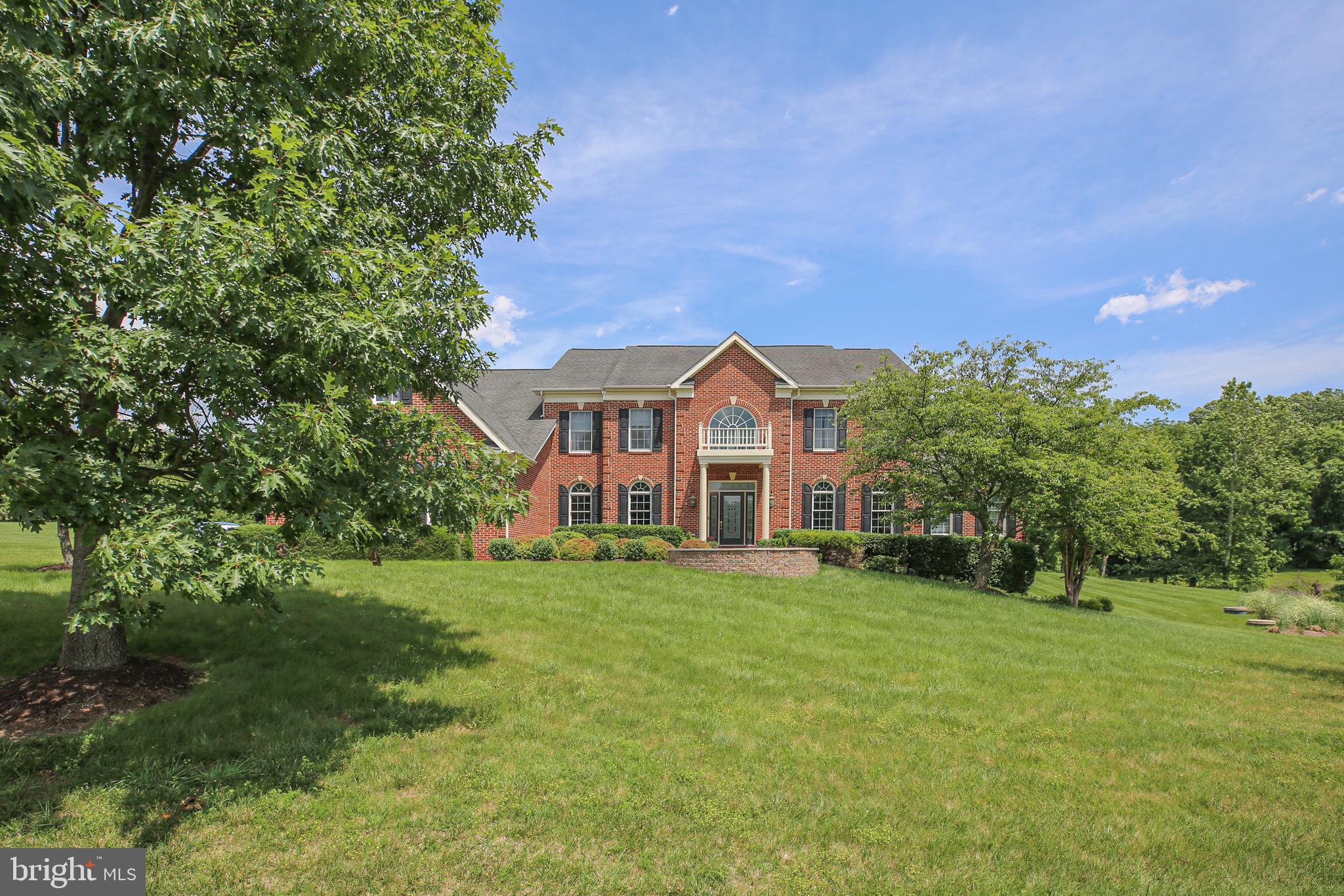 Entertainer’s dream… over 9000 Sq Ft of living space on 3 levels. this recently updated 4-bedroom 5.5 bath home, located in the highly sought-after community of the Estates at Shenstone farm in Leesburg, Virginia. This brick colonial home sits on 3.06 acres of private yard! Breathtaking entryway with marble flooring and grand dual staircase. Formal living room off of main entryway will lead to large conservatory. The french doors lead to a spacious home office, found next to half bath w/ Toto electric toilet/bidet & granite vanity. Entertain in a well-appointed formal dining room with beautiful trim, crown molding, & hardwood flooring. Enjoy the two-story family room drenched in natural light or cozy up to the fireplace making it the perfect room for family game night, movie night, & more! Freshly painted kitchen is a chef’s dream w/ bright white cabinetry, generously sized center island, granite countertops, double wall oven, walk in pantry and eat in dining. Off the kitchen you will find a spacious mud room & laundry room, and addition of a gorgeous sunroom that can function as an additional sitting room, dining space, or play area. Upper level offers huge, luxurious primary bedroom w/ tray ceilings separate sitting area, and two large walk-in closets. Relax in your en-suite bath with Roman soaking tub, his & her vanities, & beautiful frameless walk-in shower w/ double shower heads! Upper level has 3 additional bedrooms, all w/ en-suite baths. Retreat to lower level where you’ll find amazing recreation space, 2 bonus rooms, & full bath.