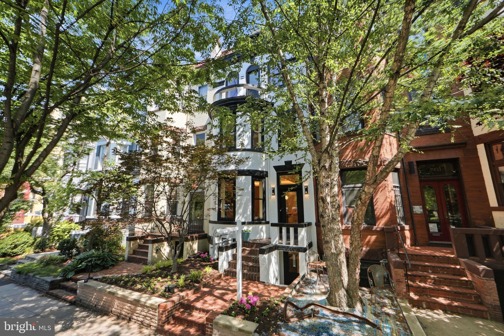 Tucked into one of Washington’s most coveted enclaves, 1933 Calvert Street NW is a masterclass in modern luxury, thoughtful architecture, and timeless craftsmanship. Behind its classic brick façade, this five-bedroom, four-and-a-half-bath residence unfolds across four impeccably finished levels, where soaring 10-foot ceilings on the main and second floors establish a sense of openness and grandeur from the moment you enter.
The home was conceived by Bonstra | Haresign Architects, a nationally recognized Washington, DC firm whose residential work has been repeatedly honored by AIA design juries for the qualities that define this residence: inventive use of space, flowing interiors, and, above all, natural light. The firm is known for reimagining the traditional DC townhouse—opening narrow urban footprints to sunlight and views, dissolving the boundary between interior and exterior, and layering refined contemporary details within the city’s historic fabric. Its rowhouse designs have received AIA recognition specifically for maximizing light, openness, and livability through contemporary architecture.
For the discerning buyer, the significance is simple: this is not a builder-grade renovation. It is a home conceived by architects whose work is studied, published, and honored throughout the region—the same elevated design standard behind some of Washington’s most admired buildings.
At the heart of the home, a chef’s kitchen pairs custom two-tone white and natural oak cabinetry with premium quartz surfaces and a complete Thermador professional appliance suite, including the range, hood, refrigerator, and dishwasher. Designed for effortless entertaining, the kitchen flows seamlessly into the home’s expansive living and dining spaces.
Site-finished white oak flooring extends throughout, complemented by designer-grade millwork, custom wall paneling, crown molding, and a striking floating staircase wrapped in frameless glass. Expansive windows and thoughtfully placed openings allow natural light to travel throughout the interiors, reinforcing the home’s architectural emphasis on openness and connection.
The primary suite is a private retreat featuring dual California Closets walk-in wardrobes and a spa-inspired bathroom dressed in full Porcelanosa marble and quartz. Heated bathroom floors add an additional layer of comfort and luxury to the serene, hotel-inspired space.
Two custom wet bars—one anchoring the finished lower level and the other serving the top-floor entertaining lounge—extend the home’s flair for hosting. Above, a private rooftop deck offers sweeping views over the nation’s capital and an exceptional setting for outdoor dining, entertaining, or relaxing beneath the city skyline.
Every detail has been carefully considered, including brand-new Andersen windows, recessed dimmable LED lighting, a dual-zone HVAC system with independent climate control on each level, and a fully finished lower level with a bedroom, full bathroom, recreation space, and private rear entrance. Two-car private parking completes the residence.
All of this is set in prime Kalorama, moments from Embassy Row, Dupont Circle, the Metro, neighborhood parks, and some of Washington’s finest dining, shopping, and cultural destinations.
Join us for a catered open house on Wednesday, July 15, from 4:00–7:00 PM.