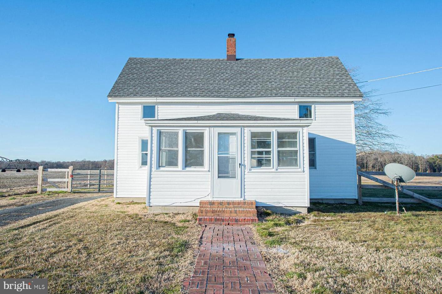Adorable home on almost 2 acres and in great location - close to shopping dining and events, 10mi to America's Coolest Small Town, Berlin, 12mi to Downtown Salisbury,  20mi to Ocean City's beach and boardwalk. Property is move-in ready and offers a spacious layout. As you enter, you are greeted by the sitting room, a bright and cheery place to chat with friends, relax and read, or catch up on your favorite TV series. Continue your tour and you will find the large eat-in kitchen with white cabinets. The spacious first-floor bedroom with a full, en-suite bath - tub/shower combo and linen closet. There is also a functional mudroom with laundry area, coat closet and an additional closet, completes the first floor. Upstairs you will find a large bonus room w/a closet which offers a flexible living space -  media room, game room, guest room - your choice! A 2nd nice-sized bedroom completes this charming home.