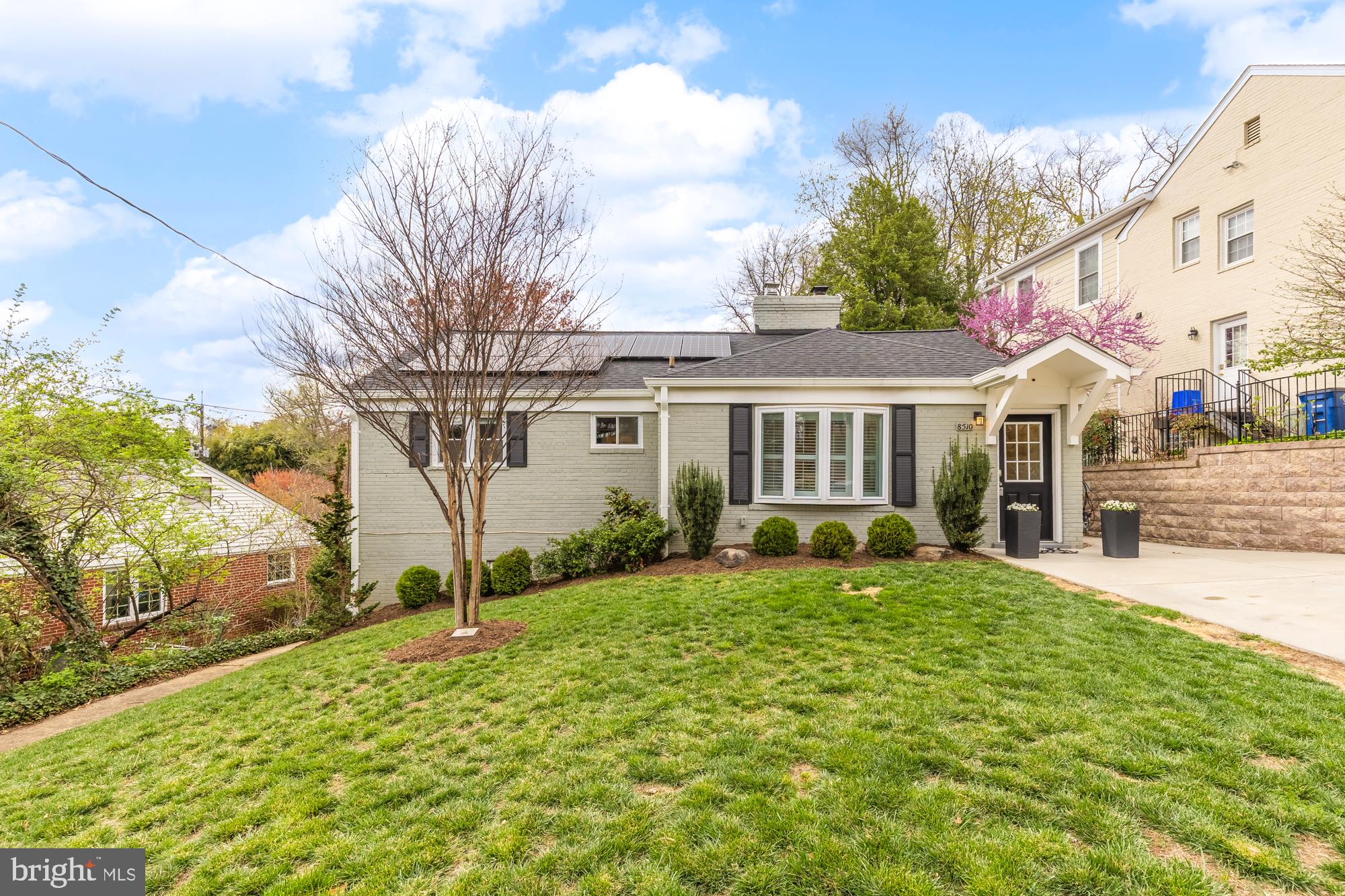Welcome to this beautifully renovated 4 bedroom, 2 bathroom home located in the sought after Rosemary Hills neighborhood. The main level boasts three generously sized bedrooms filled with natural light, complemented by gleaming hardwood floors and recessed lighting that add a touch of elegance. A cozy wood-burning fireplace enhances the inviting living room. The expanded eat-in kitchen is a standout feature with white cabinets, granite countertops, and stainless steel appliances, all accentuated by a wall of windows that lead to a stunning outdoor area complete with a new pavers patio and meticulously landscaped yard. The lower level offers a spacious recreation room, an additional large office/bedroom, a full bath, and a substantial storage area, with easy access to the rear yard through a walkout basement. This home is equipped with owned solar panels that were installed in 2022 and will convey with the property. Recent upgrades include a new roof (2022), gutters with gutter guards (2022), new attic insulation (2022) and a new concrete driveway with retaining wall (2022). Additional enhancements over the years include the installation of plantation shutters in the living room, motion sensor lights and a rear yard fence. The laundry room underwent a comprehensive renovation in 2021/2022 with a new washer/dryer and wall mounted cabinets with Elfa organization. New HVAC air compressor was installed in 2021. New hot water heater, water softener and whole house water filtration system added in 2021/2022. This is an opportunity to own a home where every detail has been thoughtfully considered, providing modern comforts and style in a prime location.