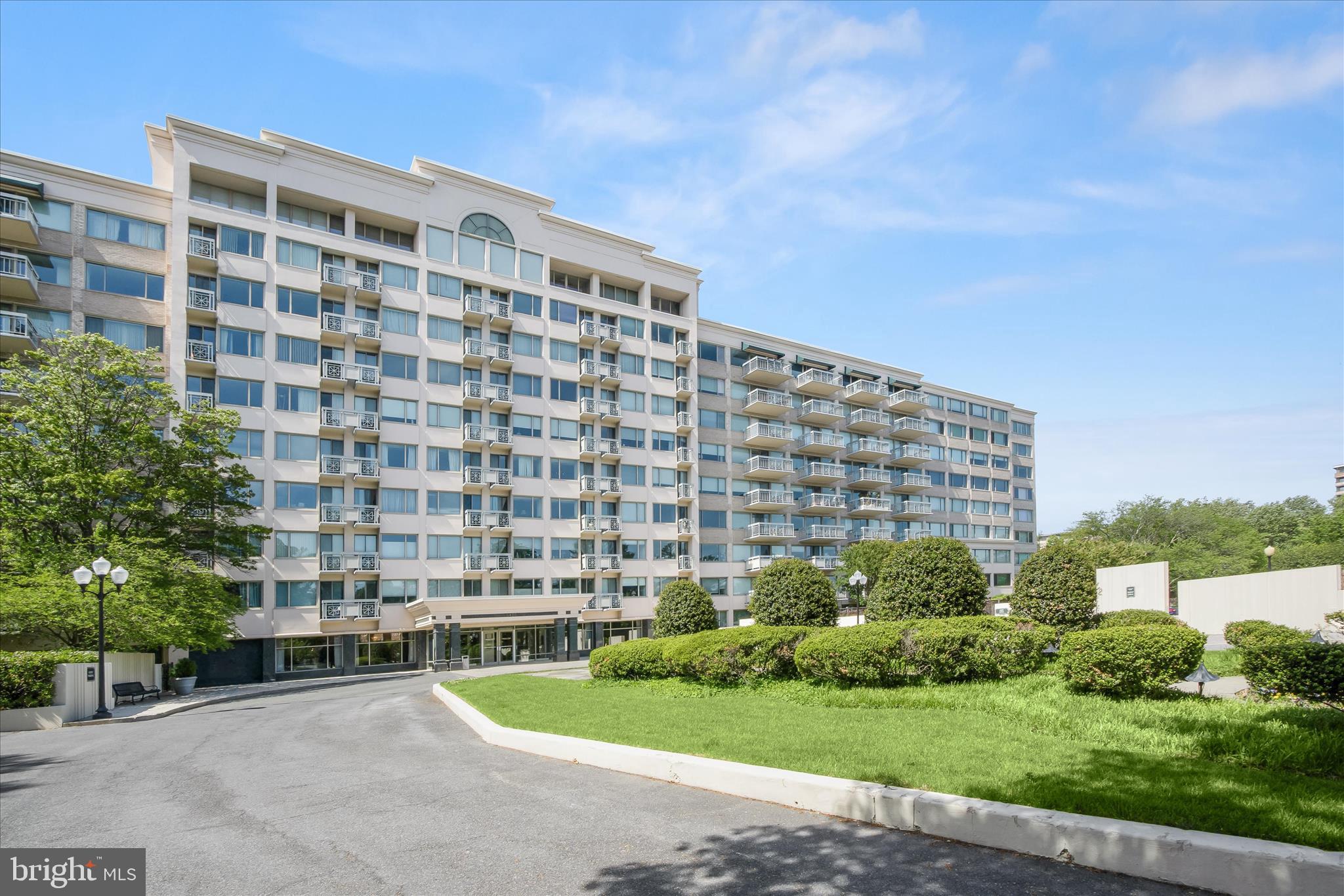Welcome to this beautifully maintained ground-level condominium in the highly sought-after Bethesda area. Enter through the main lobby with concierge service, then step into a bright, north-facing unit with an open living and dining room. High ceilings, recessed lighting, two expansive picture windows, and luxury vinyl flooring create a modern and airy atmosphere. At the same time, direct access to a private, oversized patio offers seamless indoor-outdoor living with convenient entry to the community pool and tot lot.  The kitchen is thoughtfully designed with 42” cabinetry, ample storage, updated appliances, ceramic tile flooring, and a decorative tile backsplash that adds a stylish touch. The spacious primary suite provides plush carpeting, dual closets, and a private en-suite bath complete with a glass door walk-in shower and a storage vanity. A second bedroom and a well-appointed hall bath complete the sleeping quarters.  Residents enjoy a full suite of amenities, including a library, pool, tennis courts, fitness center, and meeting rooms. The monthly condo fee covers water, cable, internet (electricity excluded), and concierge service 7 days a week. One assigned parking space (#62) is included in the garage.  Ideally located near major commuter routes such as Interstate 495 and Maryland Route 187, offering easy access to points north and south. Recent updates include flooring and a refrigerator.