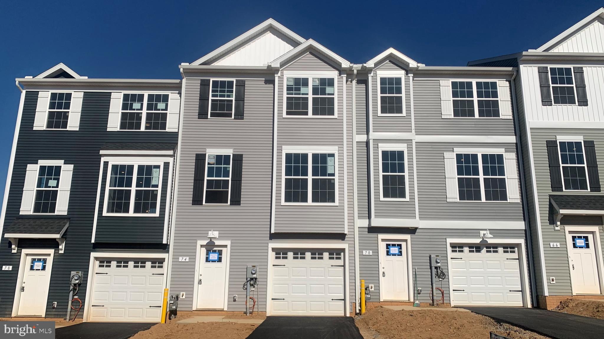 Price reduced for a quick move in.  Take advantage of the great price! Affordable brand-new construction townhome in Red Lion features up to 1720 SQFT.  Offering a low-maintenance lifestyle, our homes include a car garage with 3 bedrooms/2.5 bathrooms just minutes away from great outdoor activities and the area's top-ranking school districts. Centrally located, Red Lion is an ideal location for those commuting to the major Maryland metropolitan areas in Baltimore and Washington and the York and Harrisburg areas. On the main living level of this Interior home, it welcomes you to an enormous Kitchen featuring shaker White cabinets, granite countertops, and stainless-steel appliances with an island. The Kitchen opens onto a bright, airy Living Room, perfect for entertaining, featuring upgraded lighting fixtures and low-maintenance flooring. Upstairs are two spacious bedrooms with ample closet space, a hall bath, upper-level Laundry, a generous Owner's Bedroom with a cathedral ceiling, a huge walk-in closet, and an En Suite bathroom with granite countertops and shaker cabinets. On the entry level, you will have the convenience of a powder room and finished recreation room that will walk out to your yard.