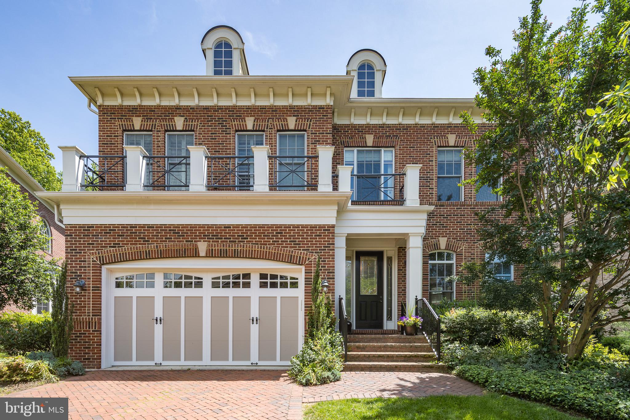 Rarely available 5BR, 4.5BA, 2-car garage, 6000 SF home in private enclave of Stockwell Manor and convenient to everything!  Absolutely stunning home built in 2008 with amazing attention to details -- deep crown moldings, every doorway and oversized-window with gorgeous millwork, high ceilings, grand staircase!  Traditional layout on main level w/LR, DR, eat-in-kitchen (all Viking commercial stainless appliances plus 2 dishwashers), FR w/fireplace, private library w/built-ins, Sunroom with cathedral ceilings and open to private rear deck, stairs down to yard.  Main level has gleaming hardwood floors, powder room, mudroom off 2-car garage and is filled with natural light.  4 BR on upper.  Owners' suite w/large sitting room, bath en suite w/soaking tub, walk-in shower w/dual rain-shower heads, dual vanities, private water-closet, 2 walk-in clothing closets.  2 large BRs w/JackNJill bath (each BR has private space w/sink, shared toilet & tub/shower).  4th BR has bath en suite and walk-in closet.  Large laundry w/sink, cabinets, and LG top-loading washer completes the upper level.  Lower level has walk-out stairs to back yard, very large rec room w/bar area (upper & lower cabinets, wine storage, sink, & granite counters), gym/exercise room, Nanny/inlaw suite w/huge closet and full bath, additional fully finished bonus room  for hobbies, play, or turn into media room, and large utility room w/plenty of space for storage.  Per HOA docs, owner can install privacy fence.  HOA provides grass mowing, and maintenance of community space including playscape, pavilion w/picnic area, walking paths, and large green fields.  Excellent location in McLean High School pyramid (Haycock and Longfellow).  So close to Falls Church City and easy access to Tyson's or Mosaic District,  shopping, entertainment, parks, libraries, and so much more.