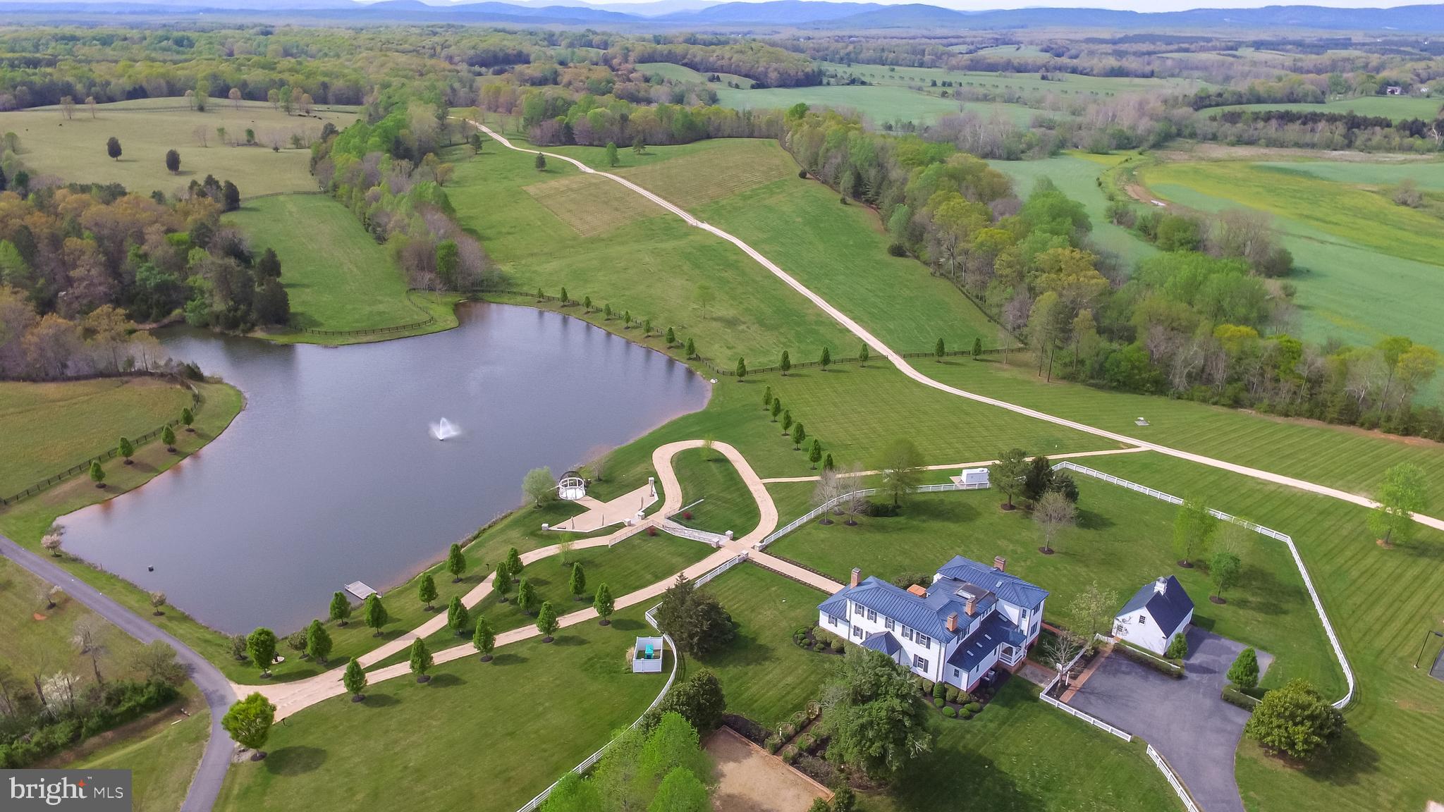 Welcome to River's Edge by the Mount Ida Reserve. This is an incredible, 430 acre property only 25 minutes from Charlottesville, Virginia. Truly a once in a lifetime opportunity that offers a wide range of options and rare investment opportunities if desired. 

Entering the property through a paved, private gated entrance lined with trees, you will shortly be met with sweeping pastoral views as far as you can see. The land has been meticulously maintained for decades, with mature oak trees, creek bottoms, and over 1.7 miles of Hardware River frontage. Wildlife is abundant, including deer, turkeys, black bear, and waterfowl. Miles of wooden cross fencing throughout the property, with multiple cattle waterers in place for those that desire livestock and grazing. This property also has the capability to be a world class horse farm if desired. 

The main residence is a fully renovated, 12,000 square foot manor with 7 bedrooms and 7 1/2 baths, including a fully finished walk-out basement. The residence perfectly blends modern luxury with rusticness, paying homage to it's historic Virginia estate roots. Each room features elegant woodwork and trim. Grand dining rooms, wooden beamed bedrooms, multiple fireplaces, game room and home gym, and covered balconies all compliment the home. One side of the home features an incredible walkway that leads to a gazebo and dock on the pond. Adjacent to the main residence is a detached, fully finished guest cottage with 1 bedroom and two full baths and a kitchen. There is also a detached temperature controlled garage as well. Recreational activities on the property are endless. Residents and guests can enjoy a full tennis court, sand volleyball court, and even a private go-cart track. The main residence is situated peacefully on the property and surrounded by seclusion.

Adding to the value of the estate are the existing investment opportunities. Firstly, the estate has 23 by-right division rights, allowing the owner to establish a high value subdivision and development if desired. A yield plan is already drawn for this development if requested. Additionally, there is a 5 acre vineyard that produces and contributes to annual profit.  The annual rental revenue is significant, with the property including a fully renovated 10,000 sq ft event barn  with catering areas, HVAC and other features. The estate boasts a farm winery license and Bed and Breakfast permit. The property is already established for weddings and corporate events with trained staff.  Additionally, the property also features two, recently rennovated, single-family homes for long term or short term rental income if desired by the next owner. These homes are along Blenheim Rd and do not share the private roads throughout the estate and manor, aiding in the privacy of the estate. 

In summary, this is a stunning, world-class property that would be an incredible family estate, event venue, corporate retreat, or future development. The location is fantastic being just South of Charlottesville, the University of Virginia, and minutes from renown wineries.