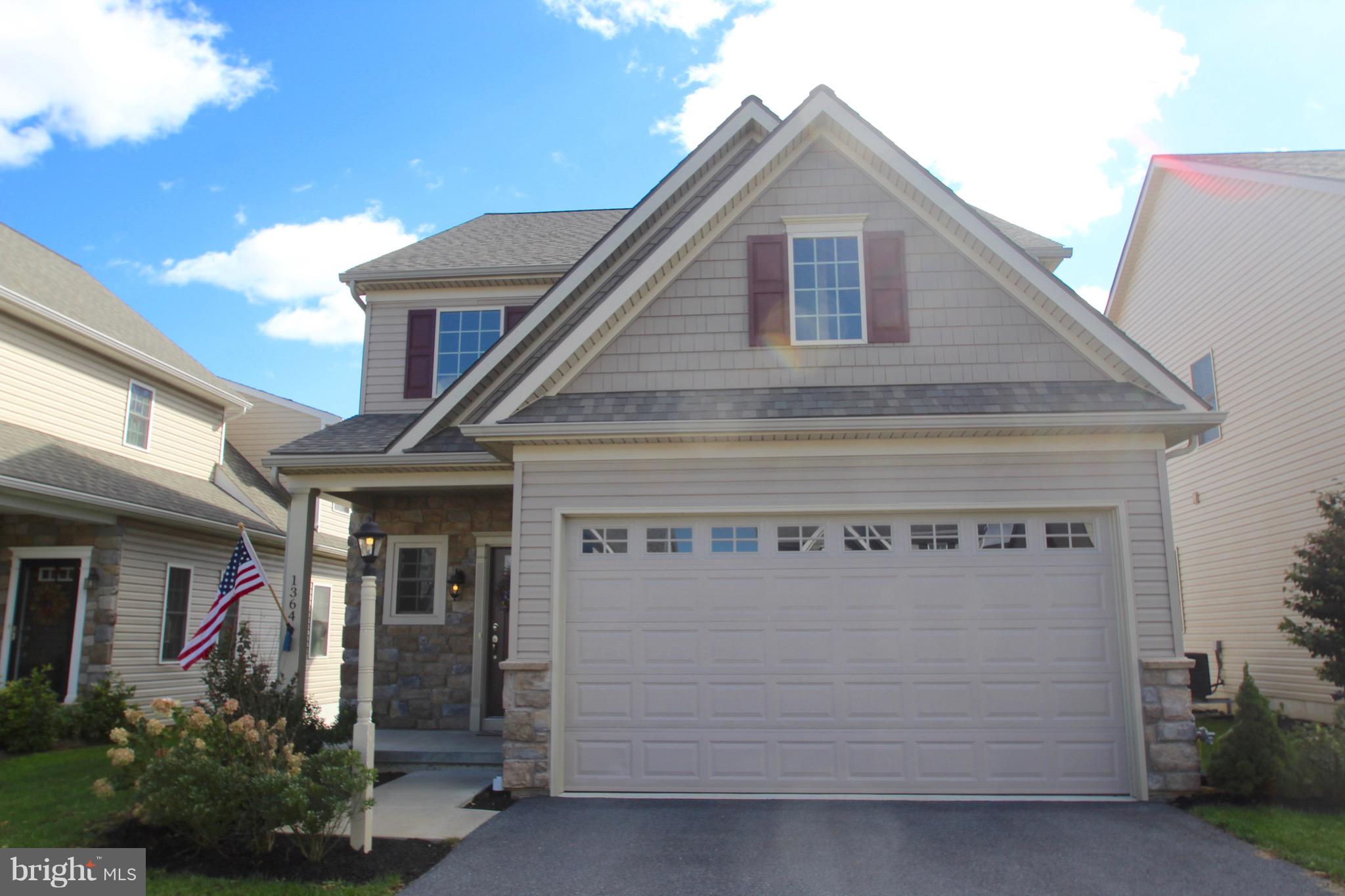 Fabulous custom home located in Elm Tree Community affords a great location with easy access to shopping and rt 283 for commuting but come inside to amazing finishes. Hardwood floors and a gourmet kitchen with granite and tile back splash, 42  cabinet s including pantry, large island with pendant lighting and overhang for bar stools...all appliances stay too. The open floor plan offers a light filled great room open to kitchen and dining room and with access to the deck. The vaulted space is open to the loft above. Generous master suite Has vaulted ceiling and a large walk in closet plus on suite bath with double sinks.Finished with main level laundry with appliances included and powder room and you never have to go upstairs...but if you do....you ll find 2 more generous bedrooms and an open loft area perfect for treadmill, office space or your use....overlooking the great room means the space is light filled and lets you be part of the activities.The daylight walk-out basement with poured concrete walls is dry and spacious + ready to finish if you need more room. The gas heat and hot water are warm and efficient, water softener included.  Luxury is the theme of this beautiful ready to move in home. You ll appreciate all the upgrades even paint! And the open  space to the rear means you won t feel hemmed in...... best of both worlds....amazing community yet open spaces. Come enjoy and relax.Association only $10/month for common areas.