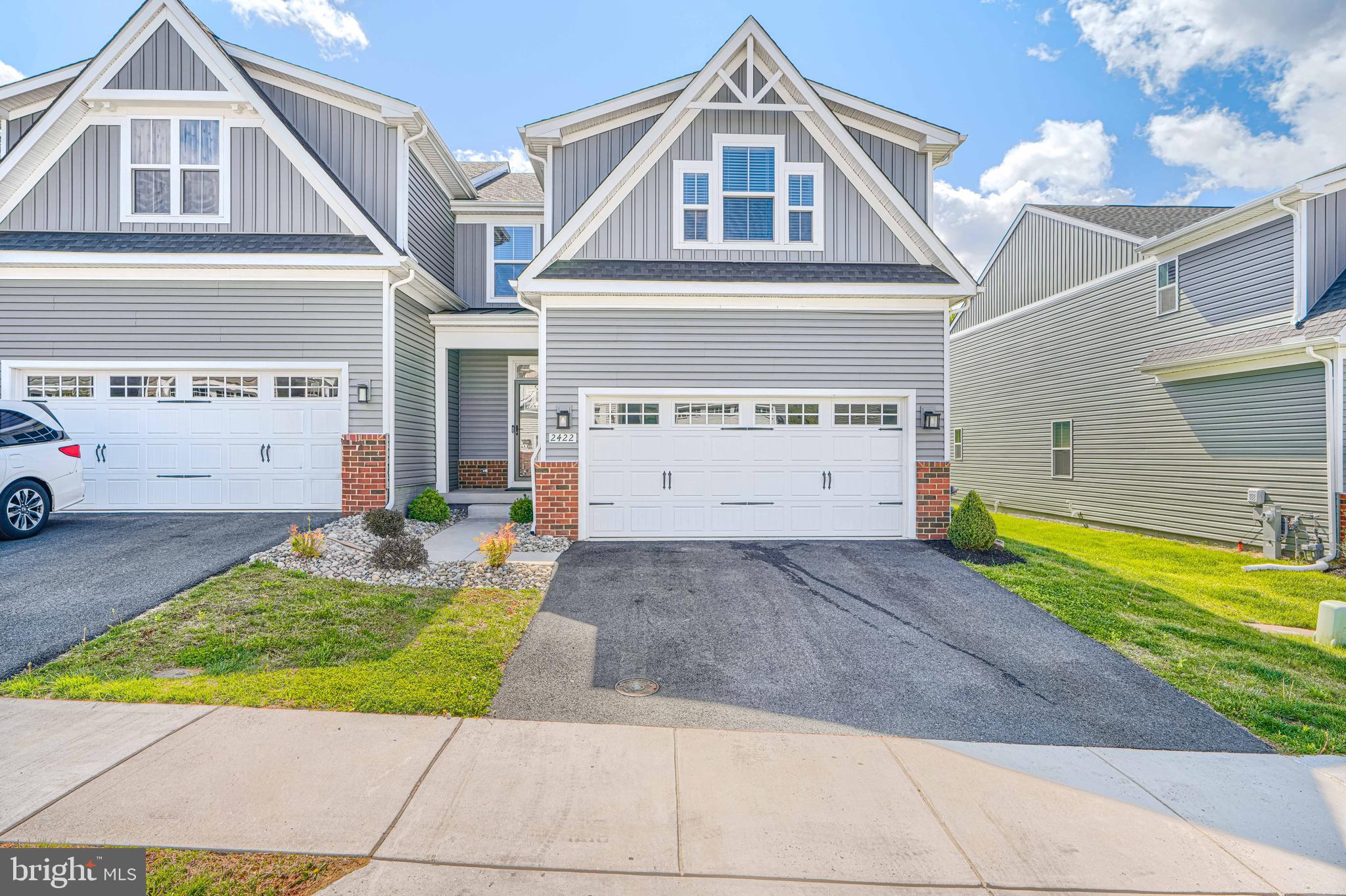Welcome home to this stunning, model-like residence filled with premium upgrades and thoughtful design throughout. Offering the ease and comfort of main-level living, this home features a luxurious first-floor primary suite complete with a spa-inspired ensuite bath, dual Roman shower with built-in seating, and a spacious walk-in closet. From the moment you step inside, you’re greeted by a stylish and functional welcome center with built-in bench seating and storage—perfect for keeping everyday life organized. The open-concept layout is ideal for both relaxing and entertaining, highlighted by a generously sized family room that flows seamlessly onto a covered, screened porch overlooking serene, mature trees.  The chef’s kitchen is truly the heart of the home, boasting a large center island, wall oven, upgraded cabinetry, and elegant quartz countertops—perfect for hosting gatherings or enjoying quiet meals at home.
Upstairs, you’ll find two additional bedrooms, including one with a walk-in closet, a full hall bath, and a versatile bonus room ideal for a home office, gym, or flex space to suit your needs.The finished basement expands your living options even further, featuring an additional bedroom with egress window and a full bath—perfect for guests or extended stays,This home effortlessly combines style, comfort, and functionality—an exceptional opportunity you won’t want to miss.