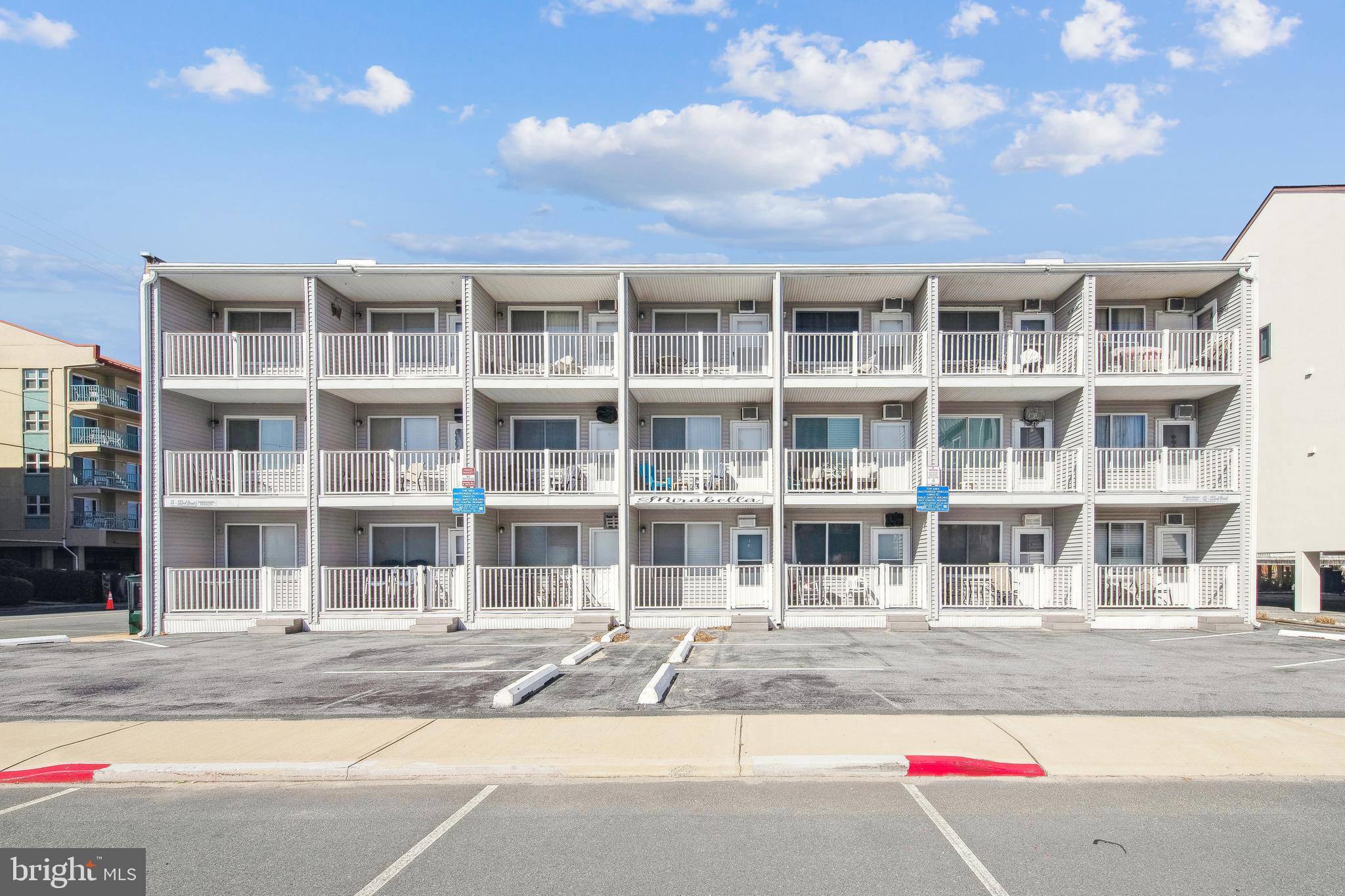 Beachside Charm at the Mirabella! Rare opportunity to own ocean block in desirable North Ocean City. Discover this charming one-bedroom, one-bathroom condo, perfect for year-round living or as a beach getaway. This bright and inviting third floor unit offers everything you need for a second home or rental investment. Sold fully furnished with tasteful coastal style furnishings and decor. The east facing balcony offers the perfect spot to enjoy morning coffee, sunbathe, or relax after a day at the beach. This fully turn-key unit is move-in ready with an updated kitchen (2020) complete with new refrigerator, stove, and microwave. The updated bathroom (2020) features a newer shower surround, fresh fixtures, and a new comfort height toilet. Enjoy year-round comfort with newer air conditioners (2021) and the added value of newer storm doors. Vertical blinds, privacy shades, and ceiling fans add a stylish touch front and back. This self-managed 38-unit building offers low condo fees, a private storage locker, and covered bike rack. Ideally located just steps from the beautiful guarded beach, you’ll love being close to Northside Park, restaurants, and shopping. Move right in and start enjoying your very own beach-side escape!