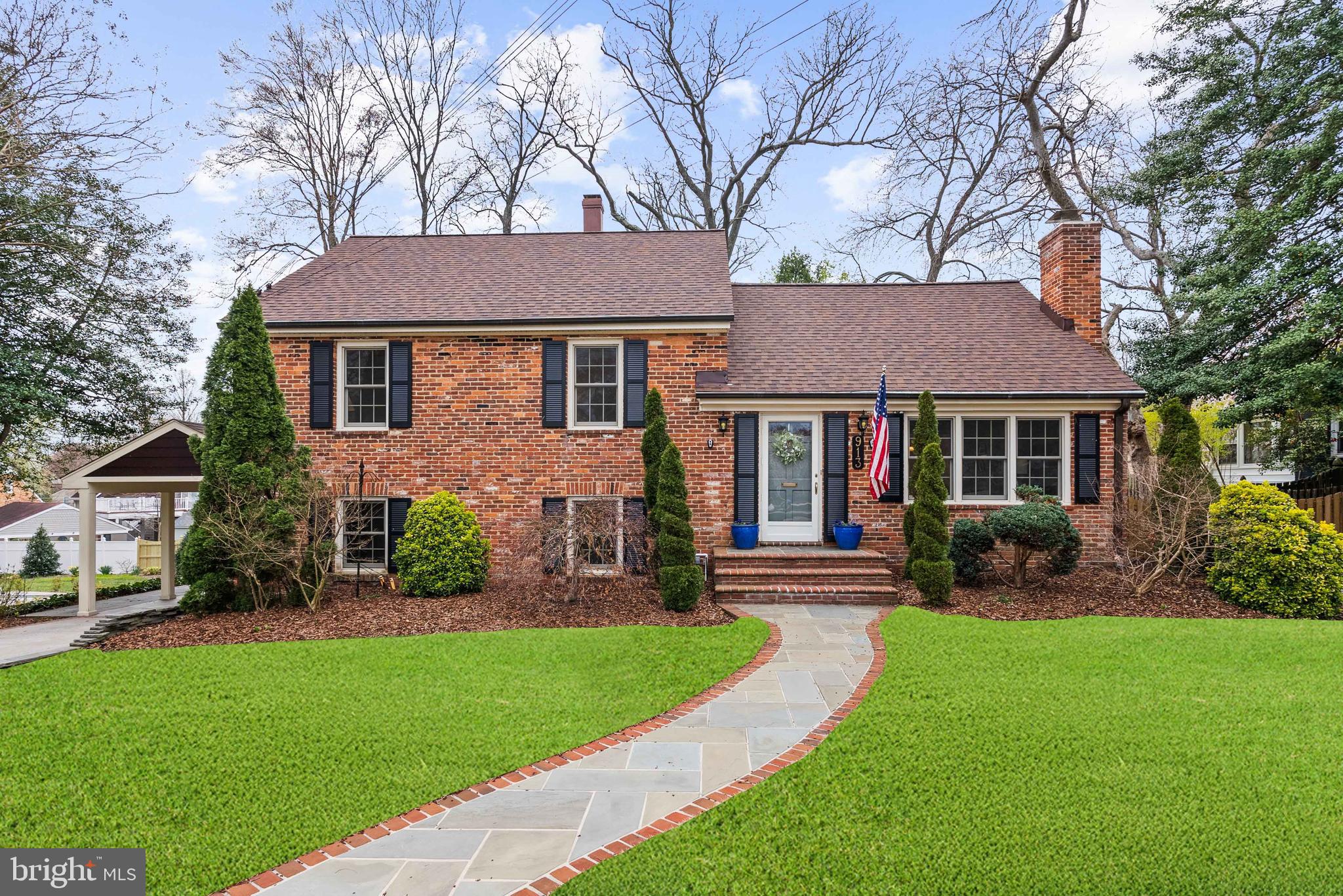 OPEN HOUSE CANCELLED FOR SUNDAY 4/6/25.  HOME IS UNDER CONTRACT
Welcome to 913 Croton Drive – a stately and updated Brick Swarthmore model sited on an attractive  lot in the heart of Wonderful Waynewood in the coveted Fort Hunt Community. Four (4) beds, Two (2) full beautifully renovated baths. Nestled on a serene street and just a short stroll to the George Washington Parkway bike path, Waynewood Elementary School and Waynewood Pool Park (pool membership required).
This attractive residence has undergone striking renovations.  Incredible gorgeous custom millwork and high-end custom tiling are found throughout the home.  
Walk up the flagstone and brick walkway, upon entering, you are greeted by gleaming hardwood flooring leading to a spacious and sun-drenched living room. A cozy wood-burning fireplace, with a black marble surround creates a welcoming ambiance. Additional main living level highlights include an updated kitchen, and a formal dining room. French doors open to the rear yard, highlighted by an expansive custom hardscaping and multilevel patios encasing stunning landscaping. Experience beautiful azaleas, roses, hydrangeas, hostas and other blooming bulbs that add color nearly year-round.  Enjoy privacy fencing and mature trees, making the backyard perfect for outdoor entertainment and relaxation.
The renovated gourmet kitchen boasts striking granite countertops, custom maple cabinetry, under cabinet lighting, stainless-steel appliances, with a lovely tile backsplash. 
On the bedroom level, relish the original hardwood, and three bright and spacious bedrooms.  Additional bedroom level highlights include custom millwork, a spacious full bath with double vanities and a tub/shower. 
One level up from the bedroom level is an additional sunny and large bedroom with its own HVAC system, and storage closet.  Expansion opportunities to turn this into a primary en-suite await. There is access to an additional attic level with storage that can also be finished off if desired to provide additional interior square footage. 
The lowest level of the home offers a versatile family room, a custom gas fireplace with a stone façade, a second updated bathroom, access to the carport (with an EV Charger), a laundry room with utility sink, and additional creative storage spaces.
The over-sized carport doubles as a covered patio complete with recessed lighting and overhead fans for entertaining on warm evenings. The backyard is simply paradise with extensive hardscaping and an all-brick outdoor chimney for warmth, ambience and smores year-round. There is a storage shed as well as an additional work shed with full electric available, ready for any hobbies.  There is a whole house generator to insure you always have power.

Recent updates include a new roof in 2023, new HVAC in upper level 2022, EV Charging station and Induction Stove 2022. 
Waynewood is more than just a neighborhood; it's a true community. This home is conveniently walkable to Fort Hunt Park, Waynewood Pool and Park, and, of course, the highly regarded Waynewood Elementary School nestled within the community.
Embrace the delightful surroundings, as the Potomac River beckons you to explore its scenic bike and walking trail along the George Washington Memorial Parkway. If you're an outdoor enthusiast who loves running, biking, or simply being in nature while staying close to the city, Waynewood has it all. Enjoy a lovely commute to Old Town, the District, Fort Belvoir, and the Pentagon, or opt for eco-friendly alternatives like biking along the picturesque George Washington Parkway or utilizing the convenient Metro Bus service to the Huntington Metro or the 11Y/F19 bus, providing carless commuting options to Old Town and downtown DC.
There's truly nothing left to do but move in and begin relishing the coveted Fort Hunt Lifestyle. Welcome home!