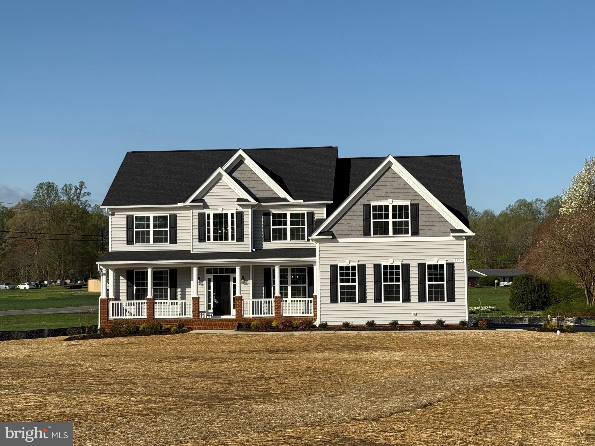 QBHI's popular Hampton floorplan in Rebecca's Field located in Huntingtown.  This home has a 2.5 sideload garage, screened in back porch and deck overlooking the beautiful backyard. Inside there is upgraded flooring, kitchen, 2 story family room with a gas fireplace, owners suite has tray ceiling and full bath with deluxe shower and huge walk in closet.  Basement is unfinished for storage and future plans.