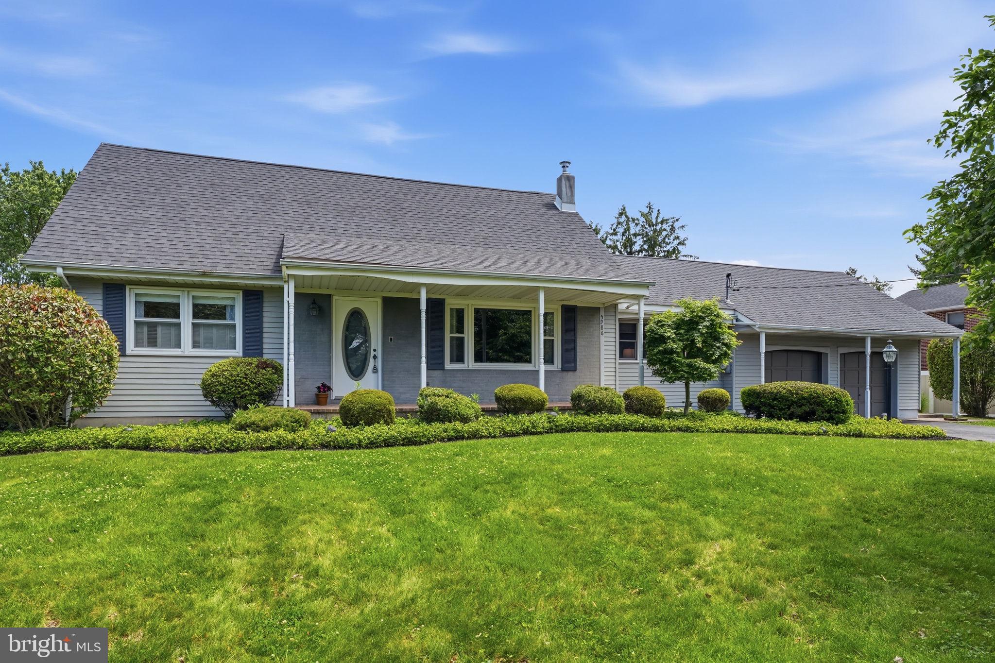 Proudly offered by the original homeowner, nestled  on a generous lot along a picturesque, tree-lined street, this charming cape-style home with a two-car garage with exceptional curb appeal is ready to welcome you Home! Step inside the welcoming foyer featuring an elegant oval-glass front door. The living room offers plush carpeting, large picture windows, and an abundance of natural light perfect for relaxing or entertaining. The formal dining room showcases a chandelier, and garden-view bay window. The functional kitchen features white cabinetry, laminated wood floors, electric cooktop and a wall oven. The family room with a vaulted ceiling flows seamlessly through a sliding door into the sunroom. The spectacular four-season sunroom boasts skylights, exposed wood beams, AC unit, wood burning stove and sliding glass doors opening directly to the deck. The oversized primary bedroom suite impresses with dual ceiling fans, multiple windows, and generous closet space. A full bath with tub/shower, tile surround, and wood-framed vanity mirror completes the main level. Upstairs, the spacious second bedroom features hardwood floors, vaulted ceiling details, and dual windows. The third bedroom offers skylights, a ceiling fan, unique octagonal window, and charming knotty pine accent wall. The full bath on this level showcases a large vanity, stylish framed mirror, and modern lighting. The full unfinished basement provides laundry hookups with washer and dryer, utility sink, Bilco doors to backyard and abundant storage potential. The incredible backyard is an entertainer's dream, featuring a sprawling multi-level deck with dining area perfect for entertaining. The sparkling in-ground pool with brand new liner has a diving board and is surrounded by a concrete patio and lush lawn, all enclosed by a fence. The expansive rear yard offers generous green space framed by mature trees and dense evergreen hedging, creating a truly private retreat. Don't wait and see how you can make this House your new HOME!