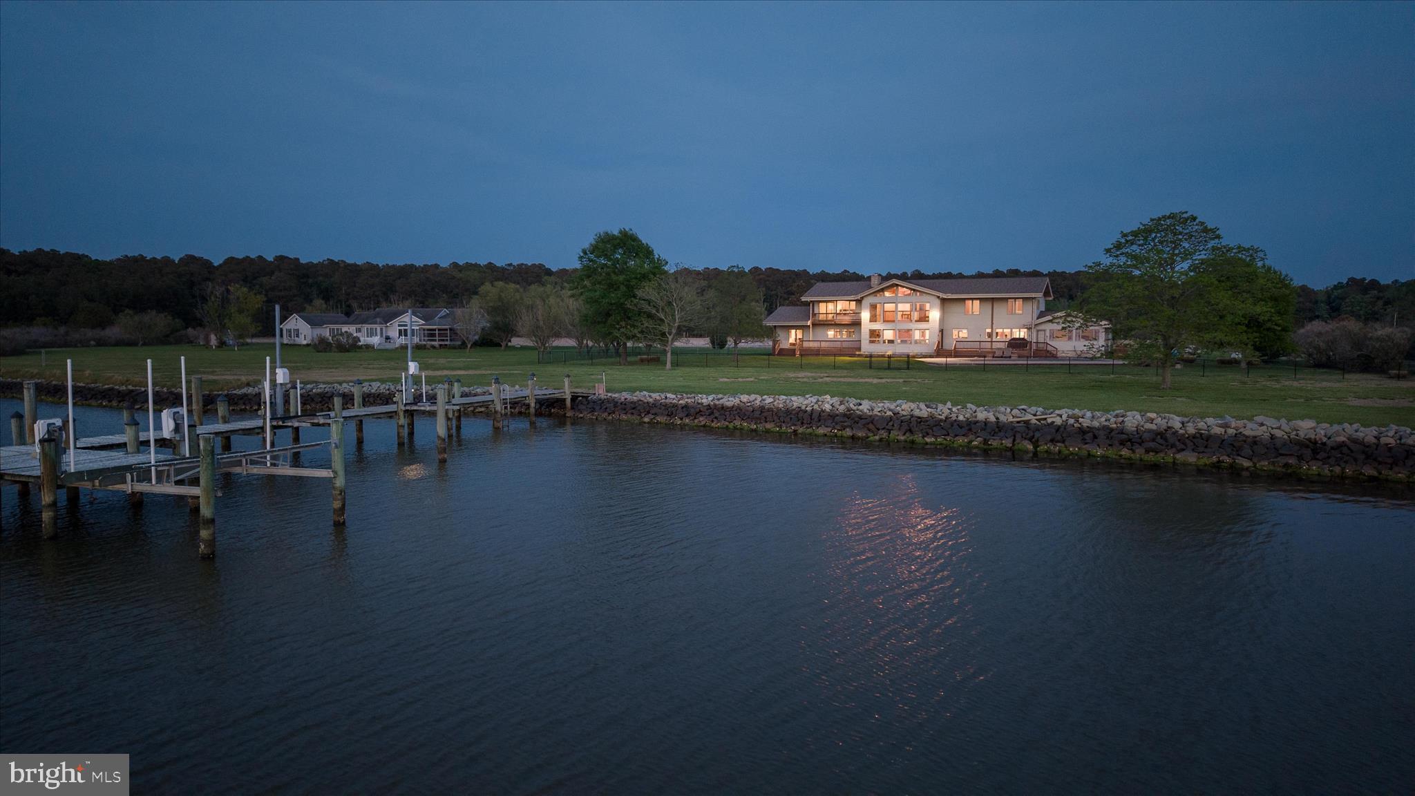 Endless westerly vistas stretch across Madison Bay, delivering breathtaking sunsets that feel like a private showing each and every evening. This is more than a home—it’s a waterfront sanctuary designed for those who expect their lifestyle to be as elevated as their surroundings.

Welcome to Saltmarsh, an extraordinary 8.5-acre estate where luxury, privacy, and coastal beauty converge. With 5 bedrooms (plus a bonus room that could be considered a 6th) and 3 full bathrooms, this property effortlessly transitions between an exceptional full-time residence and the ultimate weekend retreat for unforgettable gatherings with friends and family.

Spanning over 5,000 square feet, the home is thoughtfully designed to maximize both space and scenery, with walls of windows that flood the interior with natural light and showcase those sweeping bay views from nearly every room. The main level is nothing short of an entertainer’s masterpiece—an open-concept layout anchored by a stunning great room, seamlessly flowing into a chef’s gourmet kitchen and sun-drenched sunroom on one side, while the opposite wing reveals a full-scale game room complete with a pool table and custom bar built for hosting on any scale.

Step outside and the experience only gets better. Multiple expansive decks offer the perfect setting for everything from quiet mornings to lively evenings, all framed by panoramic water views. At the private dock, every detail has been accounted for—featuring water and electric, two jet ski lifts, and a 10,000-pound boat lift—creating a true waterfront playground.

The oversized 3-bay garage provides ample space for all your water toys, equipment, and more—because a property like this is meant to be enjoyed without compromise.

Offered fully furnished, Saltmarsh is completely turnkey—allowing you to step right into an effortless, elevated coastal lifestyle from day one.

This is not just a home—it’s a statement.