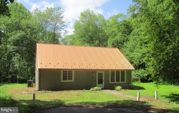 Looking for privacy on a huge 4 acre lot surrounded by trees? Then look no further! This cozy cape is waiting for you! This home features a large living room, separate dining and kitchen combo with a wood stove. 2 bedrooms are on the main level with a full bath. Upstairs features 2 additional bedrooms and storage.  Home has a lot of potential, so bring your design ideas. Out back features a concrete patio and shed. Plus a large barn/detached garage that could hold about 4 cars, or use for farming. Centrally located near the towns of Elkton and North East, and a easy drive to I-95. Come see this one today!  ***More photos coming 6/2***