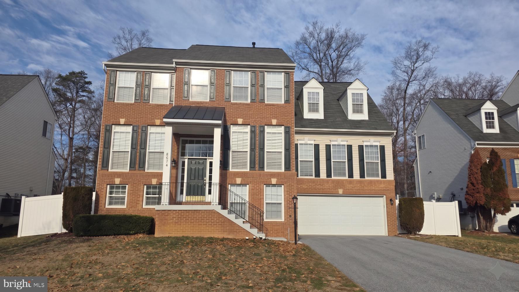 Welcome to Lanier Farms -- one of the area's most sought-after communities. This stately brick-front home, built in 2006 by its original owner, offers over 3,900 +/-square feet of living space across three fully finished levels and is priced to sell and is sold in as-is condition. Ideally situated with easy access to local amenities throughout the neighborhood._____

The main and upper levels deliver 2,900 +/- finished square feet, including a brand-new sunroom addition that brings warmth and light to the main living space. The upper level features 4 bedrooms and 2 full baths. Recent updates include a new cooktop, premium carpeting throughout and a new 6-foot white vinyl privacy fence enclosing a generous lot that backs to mature trees. And there is a brand new Sunroom off of the Kitchen._____

The fully finished basement adds over 1,200 square feet and includes a 5th bedroom, a 3rd full bathroom, a kitchenette, and a separate front entry -- a setup that offers tremendous flexibility for the right buyer.