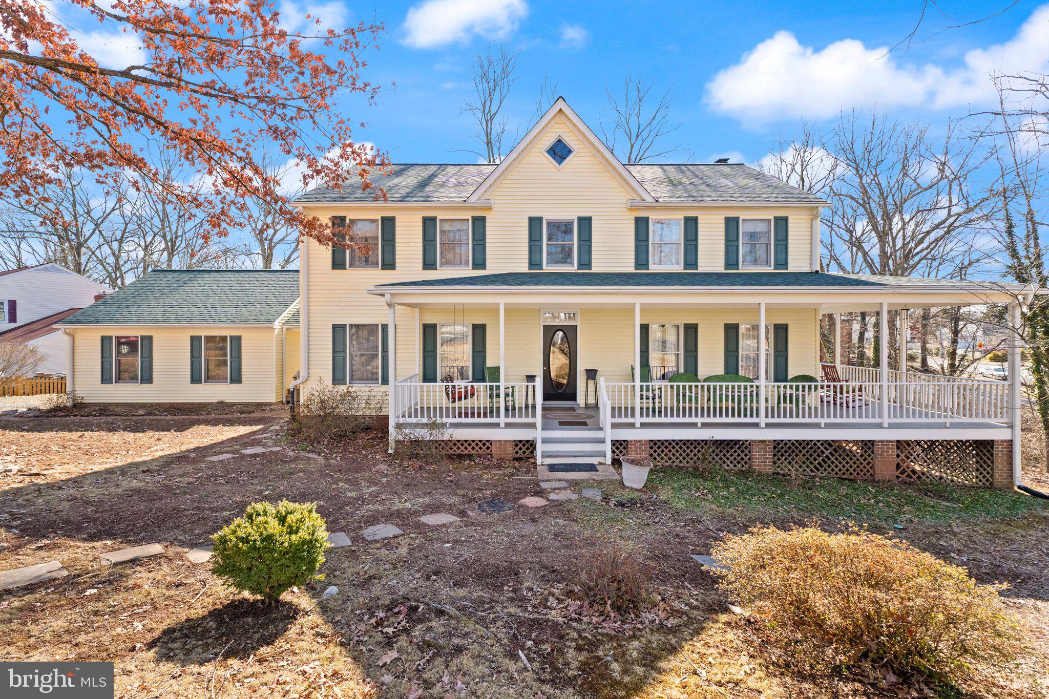 This custom-built home is nestled on a .46-acre corner lot in the heart of historic City of Manassas, offering convenient access to Rt. 234, Rt. 28, Rt. 66, and just 1.4 miles from the VRE, Old Town Manassas, and all its vibrant restaurants and events. The property features a charming wrap-around porch and a spacious deck, ideal for enjoying peaceful mornings or hosting lively gatherings. Inside, the main level boasts a large kitchen with a cozy dining area beside a bay window, a formal Dining Room, Living Room, and a Family Room with a wood-burning fireplace. Upstairs, you'll find four generously-sized bedrooms and two full baths. The primary suite is a true retreat, complete with ample closet space, including a walk-in closet, and a luxurious en-suite bath with a soaking tub, heat lamp, and walk-in shower. The 1,232 square feet of unfinished basement space offers endless potential, already roughed in for a bathroom, featuring two sliding glass doors and a fireplace, ready to be transformed into your dream space!