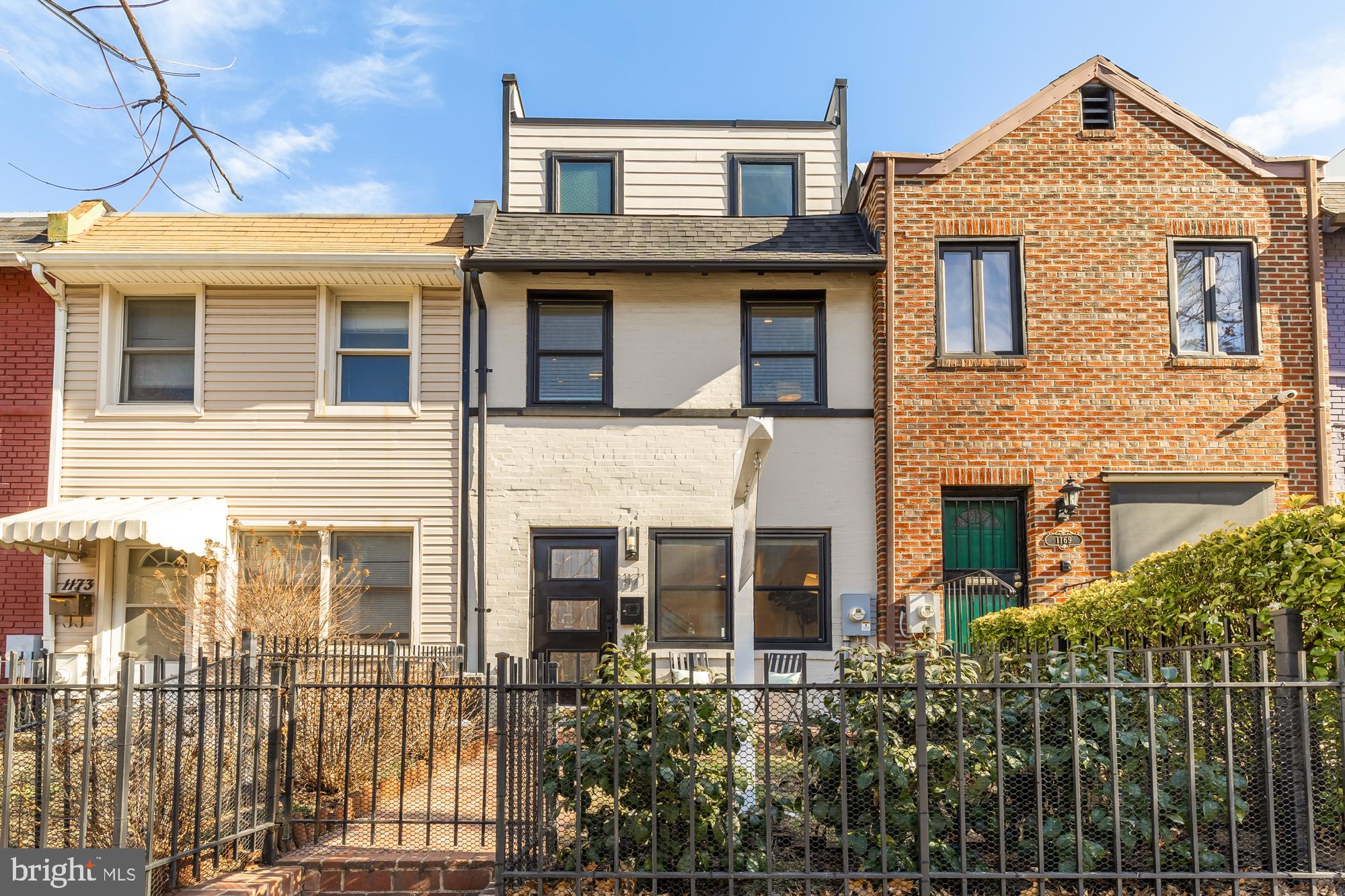 INCREDIBLE NEW PRICE! Best location in NoMa! This beautifully renovated 3-bedroom, 3.5-bathroom rowhome perfectly blends modern design with everyday convenience. Located just steps from the NoMa metro stop, Union Market, and NoMa's best shops, dining, and entertainment, this home offers the ultimate in urban living.

Step inside to find gorgeous wide plank wood floors throughout, complemented by recessed lighting and sleek, contemporary finishes. The main level features a spacious living area, a modern kitchen with marble countertops, stainless steel appliances, a gas range, and a peninsula—ideal for cooking and entertaining. A cozy dining nook leads to the back patio, where you'll find a beautifully hardscaped space perfect for outdoor living, complete with PARKING and a roll-up garage door for easy access.

On the second floor, find 2 sunny bedrooms each with its own en suite bath, offering privacy and comfort. The third floor is your sanctuary! An expansive owner's suite features a generous walk-in closet and luxurious bath with oversized glass shower and tons of natural light.

The location can't be beat-- leave your car parked out back and enjoy the convenience of being steps from the vibrant Union Market food scene, ranging from casual bites to Michelin-starred dining.  Trader Joe’s, Harris Teeter, and Whole Foods are all within a short walk, making grocery runs a breeze.  For outdoor lovers, you’ll have access to the 8-mile Metropolitan Branch Trail, as well as the Swampoodle playground and dog park—all within one block. Or head to popular Alethia Tanner Park for more green space and community events. To top it off, find yourself around the corner from the NoMa Red Line metro station, with Union Station just one stop away for quick trips out of the city.