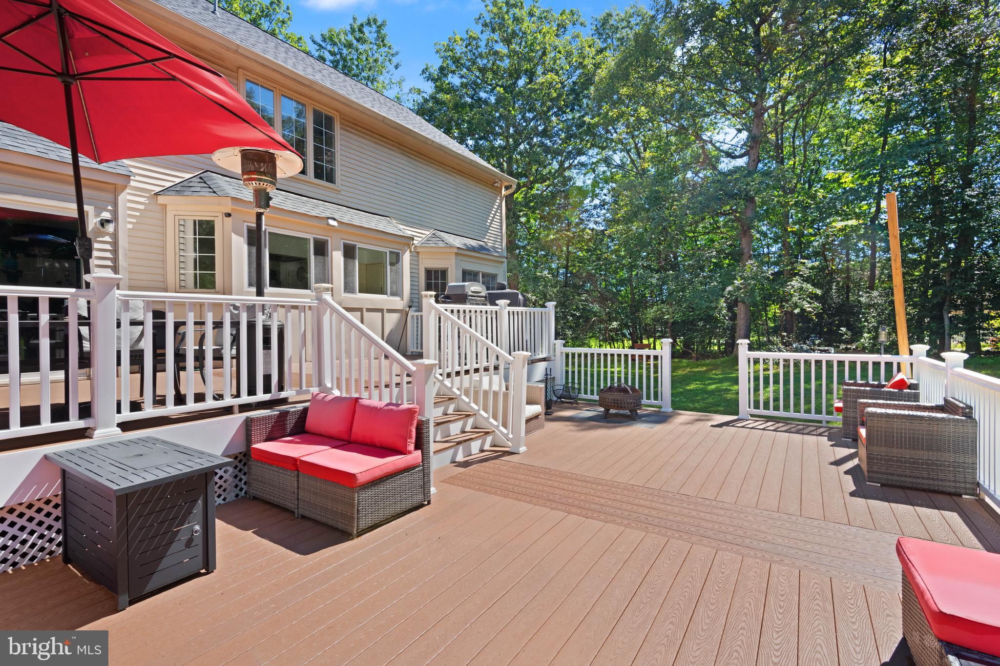 PRICE IMPROVEMENT + $5,000 BUYER CREDIT! Seize the opportunity to own one of the largest homes in the sought-after Wingate Community, now offered with a $5,000 seller credit to use toward your closing costs or a mortgage rate buydown!

Nestled on nearly an acre of peaceful wooded privacy, this 5-bedroom, 4.5-bath residence has been beautifully updated throughout. The heart of the home is a remodeled gourmet kitchen featuring granite countertops, complemented by two expansive family rooms and a private home office. Retreat to the luxury of an updated master suite, complete with designer "his-and-hers" custom closets.

The finished walk-out basement is an entertainer’s dream, featuring an upgraded bar with custom cabinetry. Outdoors, enjoy the serene views from your extended composite deck. With premium finishes like hardwood floors, a new garage door, and a durable 50-year shingle roof, this home offers both peace of mind and incredible value.