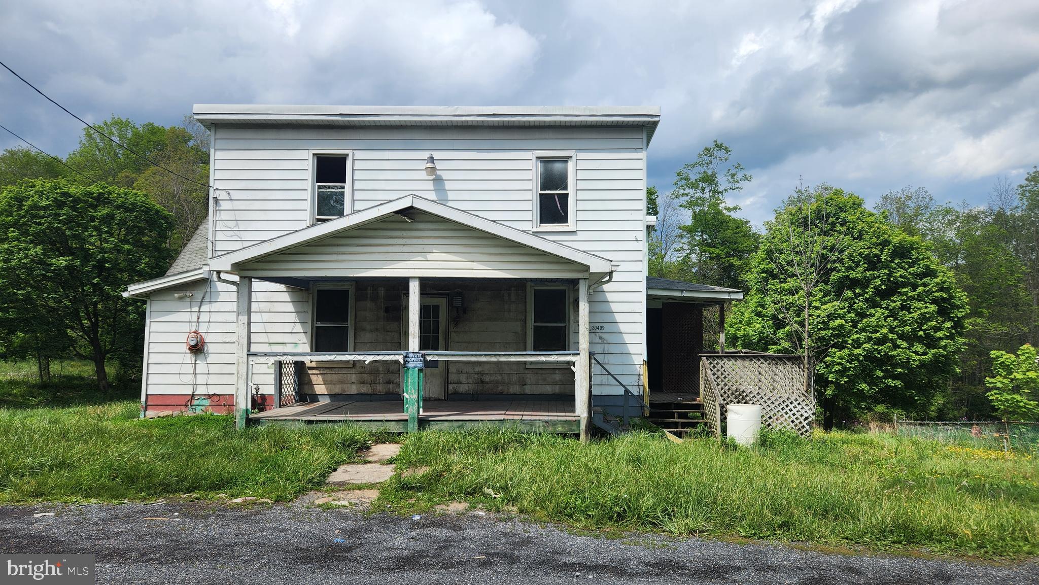 Two story house on  0.4 acre lot outside the city limits of Frostburg.  This is a Fannie Mae HomePath property.