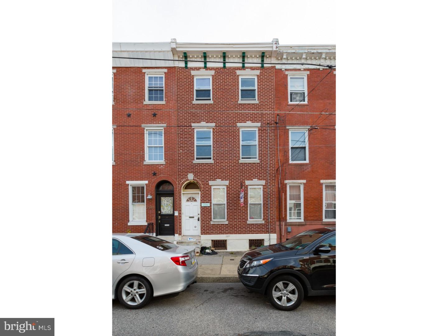 Duplex in amazing Fishtown location. Opportunity to update. Beautiful 3 story brick facade with original cornice, and arched transom entrance. Formal common entry foyer with original tile threshold. 1st floor: 1 bedroom, and 1 bath has access to the large basement and the rear yard. This apartment includes wall to wall carpeting, a rustic kitchen with plenty of natural light and ample closet space. Range included. The 2nd floor bi-level can be a 3 or 4 bedroom. Hardwood in the living room and large bay window allows a lot of natural light. Rustic kitchen is open to the the living room. There is a hall full bath with standing shower, original subway tile and pedestal sink. There is a living room and potential 3rd bedroom on this level. The 3rd floor has 1 large bedroom. Radiator heat, gas cooking, separate utilities. Some TLC is needed but the location makes this duplex a rare and awesome find! This is a legal duplex. We welcome your visit today.