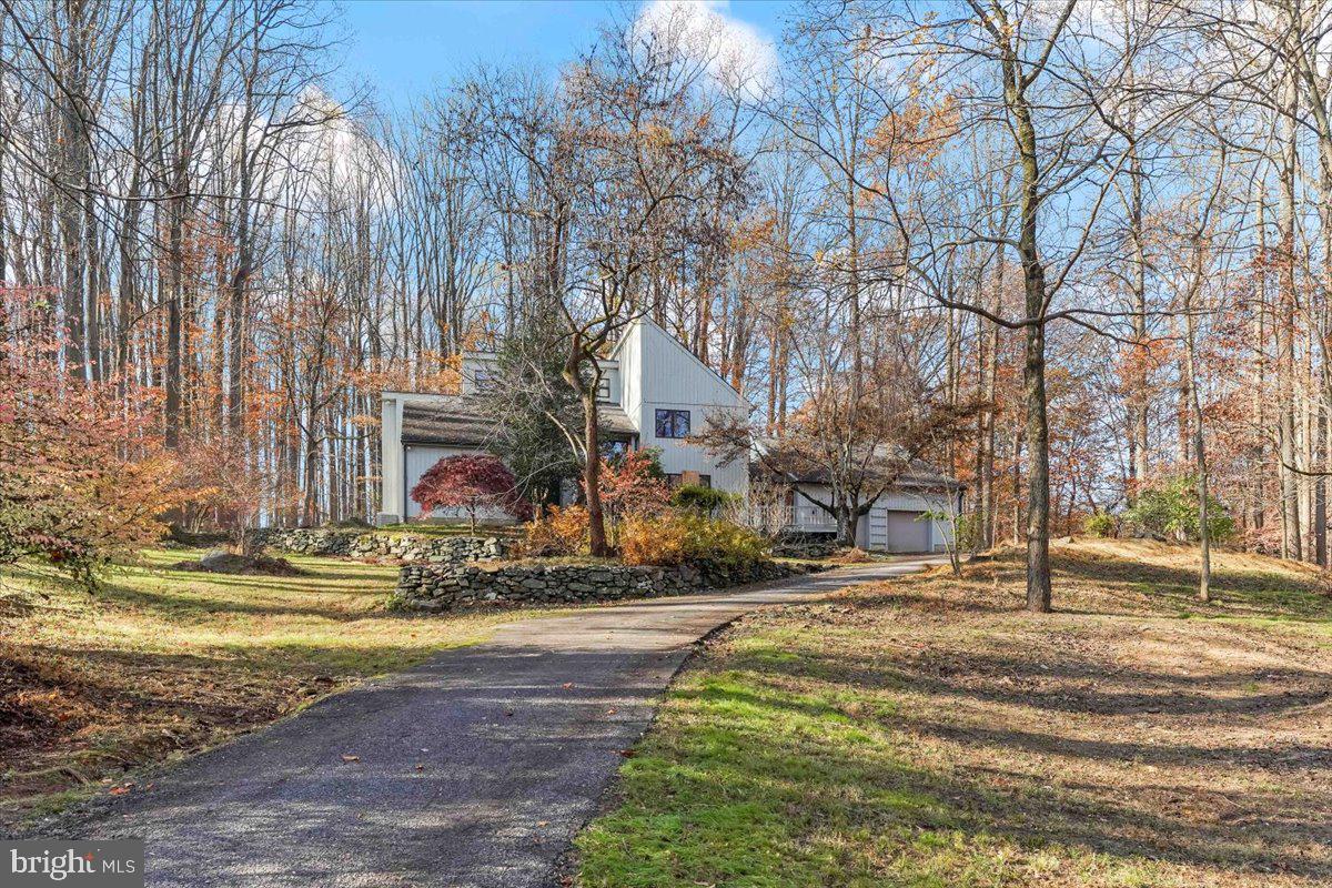 Location, location, location!  Welcome to 822 Starvegut Ln Kennett Square......one of Kennett Township's most sought after streets.  Starvegut Lane is a small private lane with just a few houses set amongst large, private lots.  This wonderful home is nicely situated on a wooded 5.5 acre lot and offers plenty of seclusion!  Considering renovating and updating this home OR consider razing the structure and building a new home, like others have done on the street!  House features lovely, open contemporary design with large room sizes throughout!  4 BR/2.5 BA/2 car Garage with lovely screened in porch and upper sun porch.  Main Floor has a bedroom/full bath which could be dedicated as an in-law suite/guest suite.  More details to come....