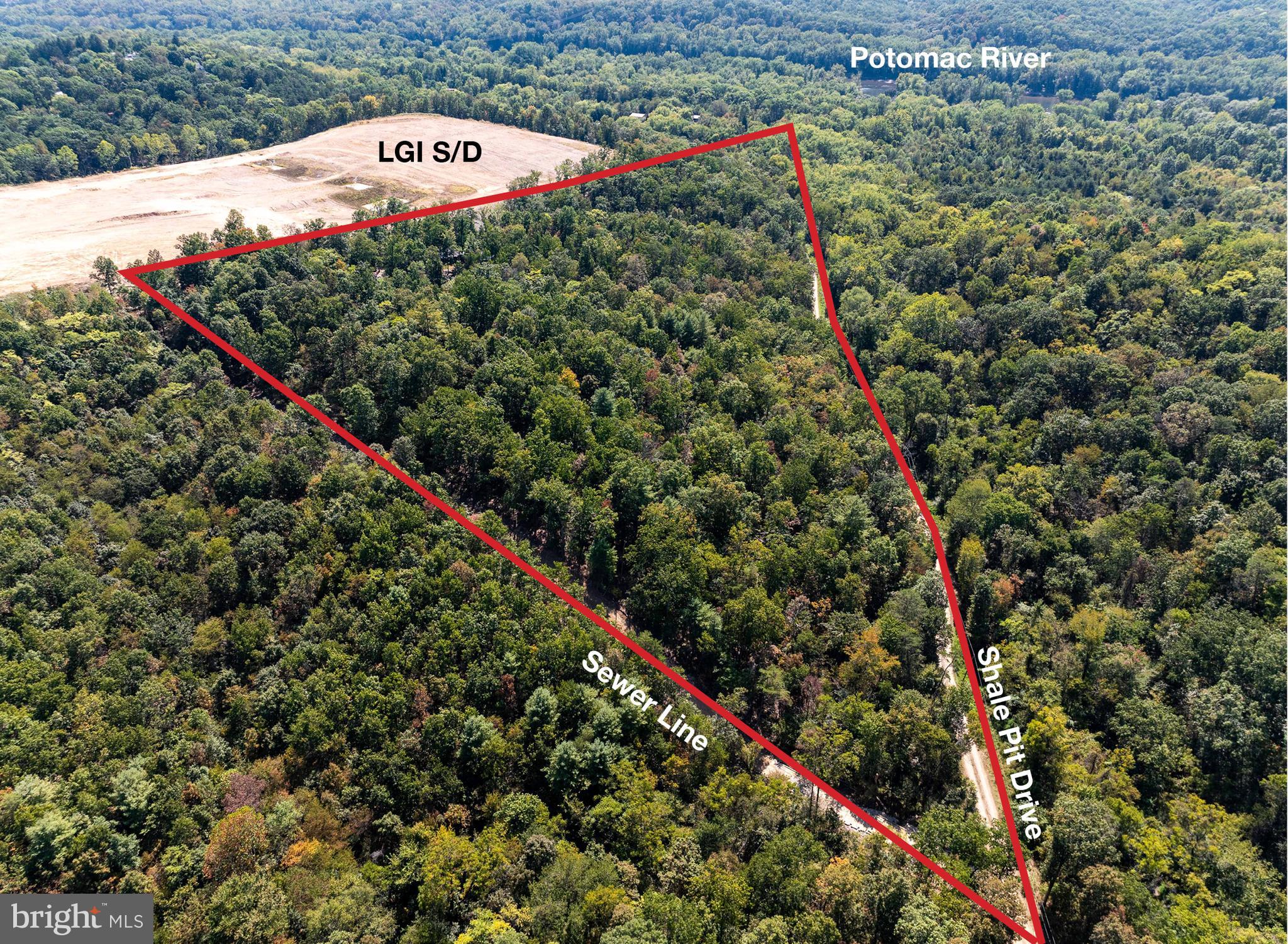 17.33 acres of wooded mountain land near the Potomac River in Falling Waters.  1600' of road frontage along Shale Pit Dr. Public Sewer right of way along rear boundary with sewer tap. Potential for subdivision with Berkeley Co Planning Dept verification.  The driveway is already cut into the property.  Very rustic hunting cabin (needs work).  Electric to cabin.  No driveby's please.