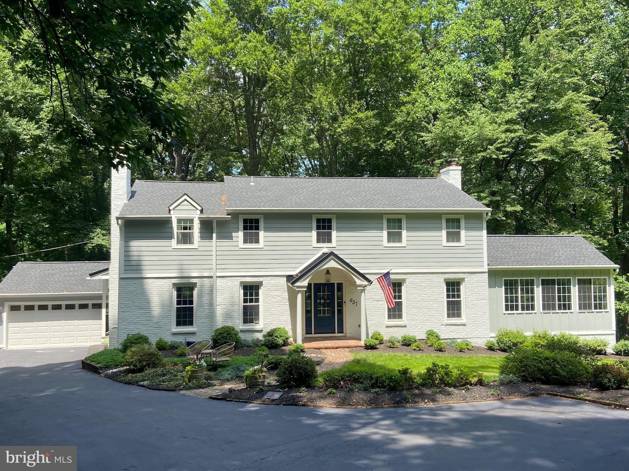 Welcome to 637 Timber Lane, a beautifully updated and move-in ready, Center Hall Colonial home located in the highly sought-after Shand Tract neighborhood, known for its vibrant community spirit and array of activities. Boasting 5 Bedrooms and 3.1 Baths, the residence is the perfect mix with a gorgeous, updated Kitchen, and beautiful gray and white Baths, blended with classic hardwood flooring, crown molding, and generous sized living spaces.
The Kitchen is a chef's dream with stunning Carrara marble countertops, a beautiful mix of light gray and wood cabinets, high-end stainless steel appliances (primarily Jenn-Air), wine storage, and a Breakfast Bar. It overlooks the brand new deck with stunning views of the backyard and private woods behind the house, allowing easy entertaining and a quiet, private ambiance.  Adjoining the kitchen is the Breakfast Room, currently serving as an additional sitting area.
The expansive Living Room, ideal for gatherings, is highlighted by the wood-burning fireplace and large windows that flood the space with natural light. It is spacious enough to accommodate a dining room table, allowing you to enjoy scenic views as you dine. Adjacent to this space is a wonderful Family Room/Sunroom with a vaulted ceiling, and walls of windows, creating a bright and airy atmosphere, as well as room and spaces for everyone. 
The formal Dining Room, currently utilized as a first-floor Home Office, also features a cozy wood-burning fireplace. Conveniently located off the kitchen is a Mudroom area with a side door to the driveway, and a charming powder room featuring chair rail and wainscoting.
Upstairs, the Primary Bedroom suite offers a luxurious retreat with an updated en-suite Bathroom, including a seamless shower stall, soaking tub, private toilet room, and access to a very large walk-in closet. Down the hall, you'll find three additional spacious Bedrooms, an updated Full Hall Bath with a tub/shower combo.
The finished lower level is an entertainer's dream, featuring an enormous Media Room with a wood-burning fireplace, two sets of glass sliding doors leading to the lower rear Patio, a fifth Bedroom, a Home Office with built-ins, a full Bathroom, and an unfinished Laundry Room where the laundry arrives by way of the 2nd floor laundry chute.  There is also ample storage space.
Outside, the home is surrounded by fabulous mature landscaping on a sprawling 2.3-acre lot. The home resides within the Tredyffrin-Easttown School District, celebrated for its top-ranked public schools, ensuring an exceptional educational experience. Conveniently located close to major commuter routes, shopping destinations, and dining establishments, including downtown Wayne, Gateway Shopping Center, Whole Foods and Wegmans, the Devon Horse Show, and Septa Regional Rail. Experience the perfect blend of style and comfort at 637 Timber Rd, your dream home in the heart of Devon.