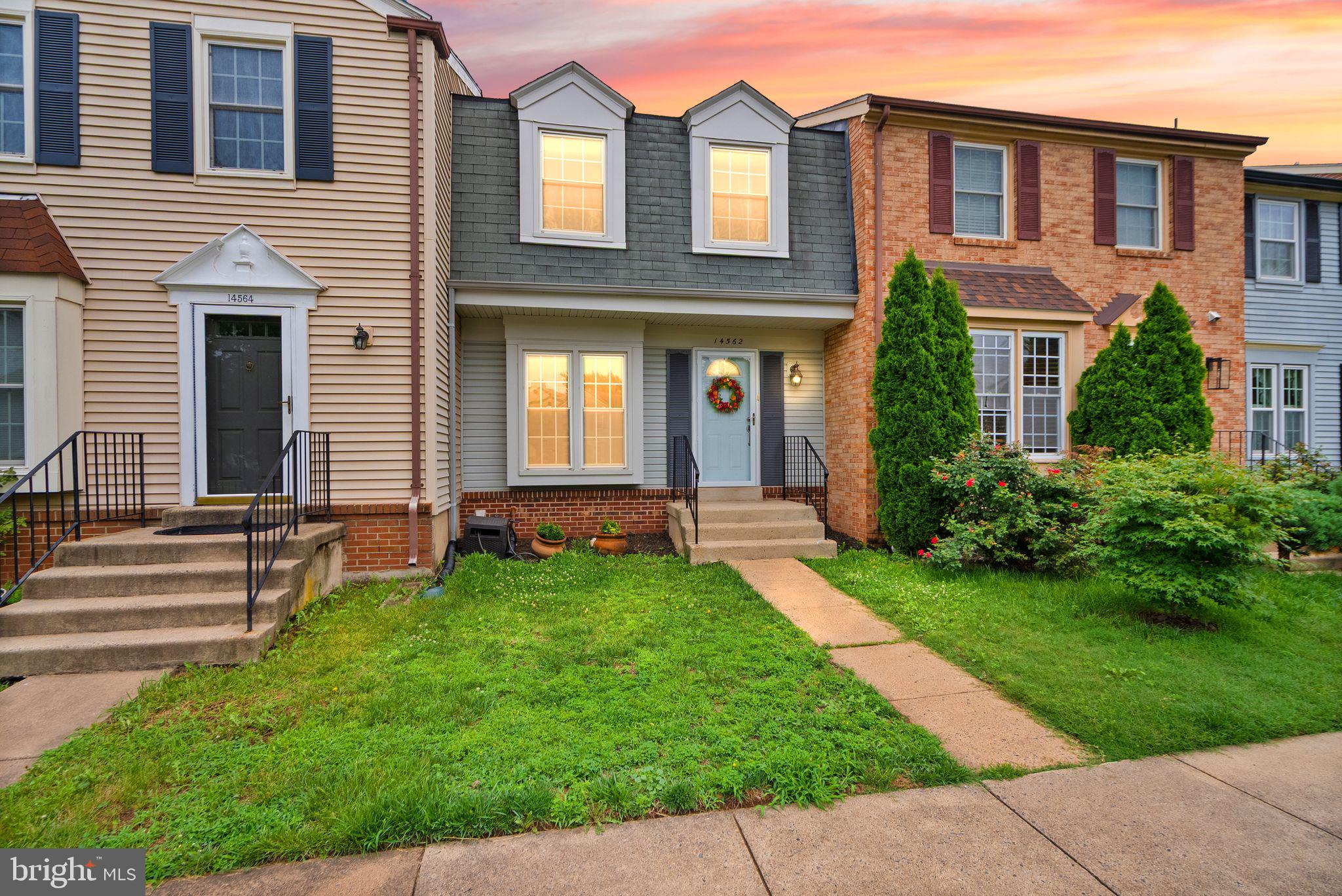 Tucked into Centreville's welcoming Newgate community, this beautifully updated townhouse blends timeless comfort with thoughtful improvements, creating a home that's ready to be enjoyed from day one. Fresh paint, wide-plank hardwood flooring throughout the main and upper levels, and elegant wrought iron staircase balusters create a warm, inviting atmosphere the moment you step inside.

The open-concept main level is designed for the way you live, offering comfortable gathering spaces that flow effortlessly into the bright kitchen featuring granite countertops, gas cooking, and plenty of room to cook, connect, and entertain.  Off the main living area through bright sliding doors awaits a fully-fenced stone patio and wood deck. The deck and fence are newly stained and very little yard maintenance is required out back, maximizing your time for relaxation, grilling, and entertaining guests!

Upstairs, the spacious primary suite provides a private retreat with an updated en-suite bath, while the second bedroom offers flexibility for family, guests, or a dedicated home office. Every bathroom has been tastefully updated, creating a cohesive, move-in-ready feel throughout the home. One less thing to think about!

The fully finished lower level expands your living space even further with a cozy wood-burning fireplace, making it the perfect setting for movie nights, game days, or simply unwinding after a long day.

Life extends well beyond your front door. Newgate residents enjoy exceptional community amenities including a swimming pool, basketball and tennis courts, tot lots, and beautifully maintained common areas that encourage neighbors to connect and enjoy the outdoors. Convenient commuter routes, shopping, dining, parks, and schools are all just minutes away, making everyday errands and weekend plans refreshingly simple. HVAC well maintained with new UV Air scrubber. Electric panel replaced in 2021.

With two assigned parking spaces, abundant guest parking, and a location that balances community charm with everyday convenience, this home offers more than beautiful updates. It offers a lifestyle that's easy to settle into and even easier to love.