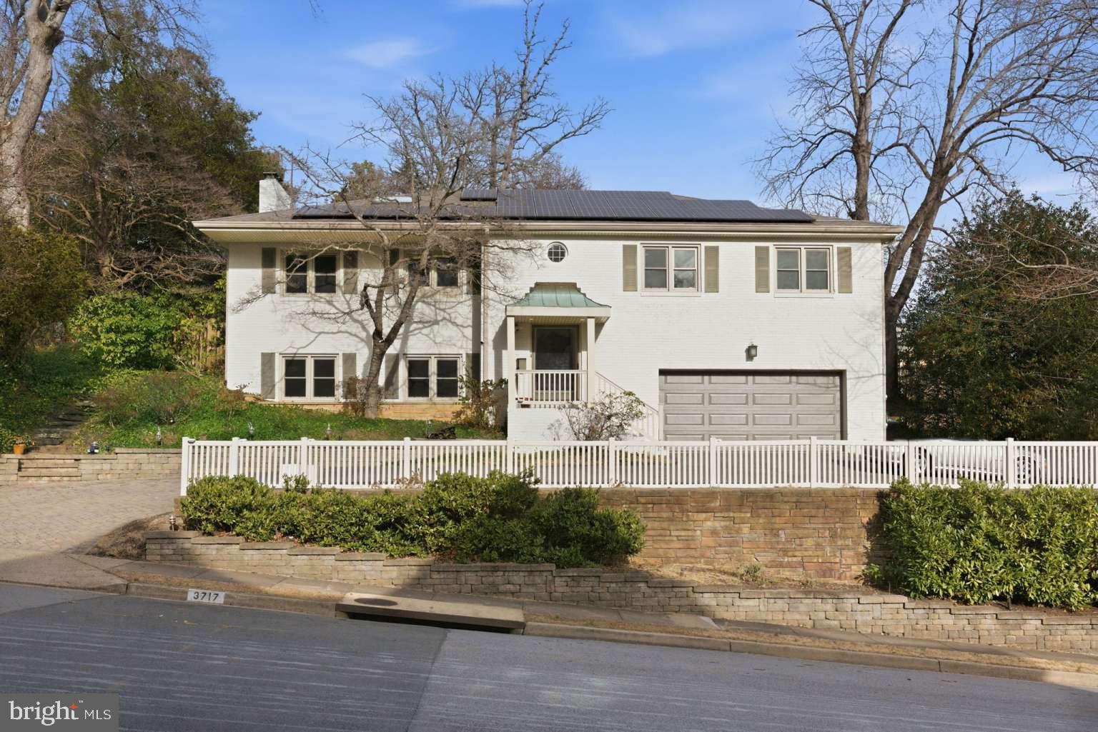 More than $240,000 of upgrades! Ask for a full list of upgrades since mid 2025! Tucked away in the highly sought-after River Crest and the Bellevue Forest Country Club Hills neighborhood, this beautifully expanded all-brick home offers a rare combination of classic architecture, thoughtful updates, pleasant modern touches, and everyday ease. The approach alone sets the tone—mature trees, manicured grounds, and a paver-lined driveway leading to a two-car garage create an immediate sense of arrival. Inside, the home opens into bright, welcoming, light-filled spaces designed to feel both comfortable and refined. Hardwood flooring runs throughout the main level, anchoring the home with warmth and continuity. The reimagined kitchen is a true centerpiece, featuring granite countertops, professional-grade appliances, and an informal dining area that encourages casual gathering. Just beyond, an oversized dining room centered around a wood-burning fireplace offers a natural setting for memorable meals and entertaining. A standout feature of the home is the Great Room addition, where expansive windows stretch from floor to ceiling, drawing the outdoors in and filling the space with natural light. This room connects seamlessly to the backyard, creating an easy flow for indoor-outdoor living. Outside, the private setting includes a patio, small pool, and multiple seating areas surrounded by greenery—ideal for both entertaining and quiet relaxation. Notably, unlike many nearby homes, this property offers a full sense of privacy, with no neighboring views overlooking the patio or yard, preserving a peaceful and secluded atmosphere. The main level is completed by the primary suite with his-and-hers sleeping areas and a shared ensuite bath, along with two additional bedrooms served by a well-appointed hall bath, offering flexibility for guests, or home office needs. The lower level extends the living space with a relaxed, entertainment-focused design. A large recreation room includes a projector with a 120-inch screen and a wood stove that adds warmth and character. A private sauna, located adjacent to the newly completed full bathroom, provides a spa-like retreat. This level also includes a laundry room and direct access to the ground-level oversized two-car garage, which is equipped with an EV charging station. Efficiency and sustainability are built in, with fully owned solar panels helping reduce ongoing energy costs. Major system updates include fresh interior and exterior paint, full bathroom extension and upgrrades, lighting and eleectrical, flooring, windows, laundry room, other major renovations (2025-26), new Great Room windows (2024), a boiler and copper piping (2023), a complete kitchen renovation (2022), a new water heater (2026), a pool refinish (in progress), and an HVAC system (2018). Conveniently located near the GW Parkway, the home offers easy access to Washington, D.C., Reagan National Airport, and Tysons Corner, while remaining close to idyllic landscapes, local parks, trails including Potomac Heritage Trail, Potomac Overlook Regional Park, Gulf Branch Nature Center, shopping, dining, and country clubs. Zoned for Jamestown Elementary, Williamsburg Middle, and Yorktown High, this property delivers a balanced lifestyle where location, comfort, and long-term value come together seamlessly. away from the nation’s Capital, Bellevue Forest offers active community involvement and a place for people to plant their roots and enjoy every aspect of their lives.