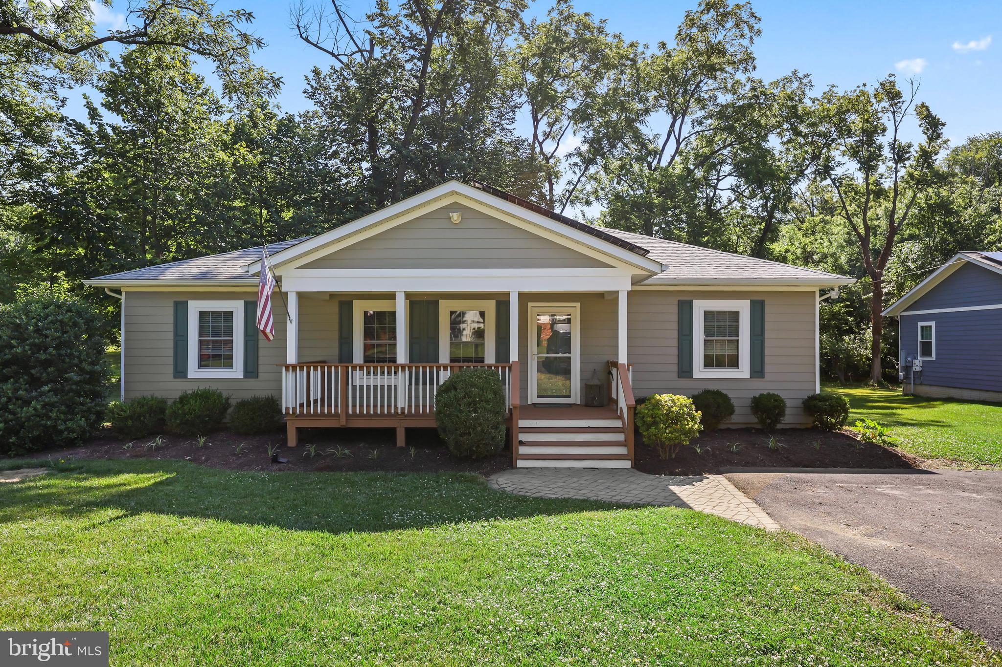 Nestled on a peaceful lot just outside the Town of Hamilton, this beautifully maintained home offers the perfect blend of rural charm, modern efficiency, and everyday convenience. Enjoy the benefits of Loudoun County living with no Town of Hamilton taxes, while remaining just minutes from major commuter routes, shopping, dining, and top-rated schools. Built in 2018 and thoughtfully maintained, this energy-efficient home was designed with long-term savings in mind. Features include owned solar panels, Hardie Board siding with additional foam board insulation, insulated interior walls, blown-in attic insulation, a humidity-controlled attic fan, and climate-controlled storage beneath the home spanning nearly the entire footprint. Utility costs remain remarkably low, with the current electric budget averaging just $80 per month. Inside, you'll find freshly painted interiors, beautiful 5" bamboo hardwood flooring, updated lighting, refreshed bathroom tile grout, and a bright, open layout designed for comfortable living. Natural light pours in through solar tube skylights, while the dining room features a stylish new chandelier. Outdoor spaces have been equally cared for, with a freshly painted front porch and rear deck, new driveway spotlight, fresh landscaping mulch, and plenty of room to expand. The generous lot offers potential for a future garage, addition, all-season room, or hobby farm pursuits. Zoned agricultural and free from HOA restrictions, the property provides flexibility for gardening, chickens, honeybees, or a home-based business. Additional highlights include Verizon Fios availability, ample attic storage, climate-controlled lower-level storage with spray foam insulation, sump pump drainage system, and a quiet neighborhood setting surrounded by the beauty of Western Loudoun County. Move-in ready, exceptionally efficient, and packed with value—this is a rare opportunity to own a newer home in Hamilton with lower operating costs, flexible land use, and room to grow.