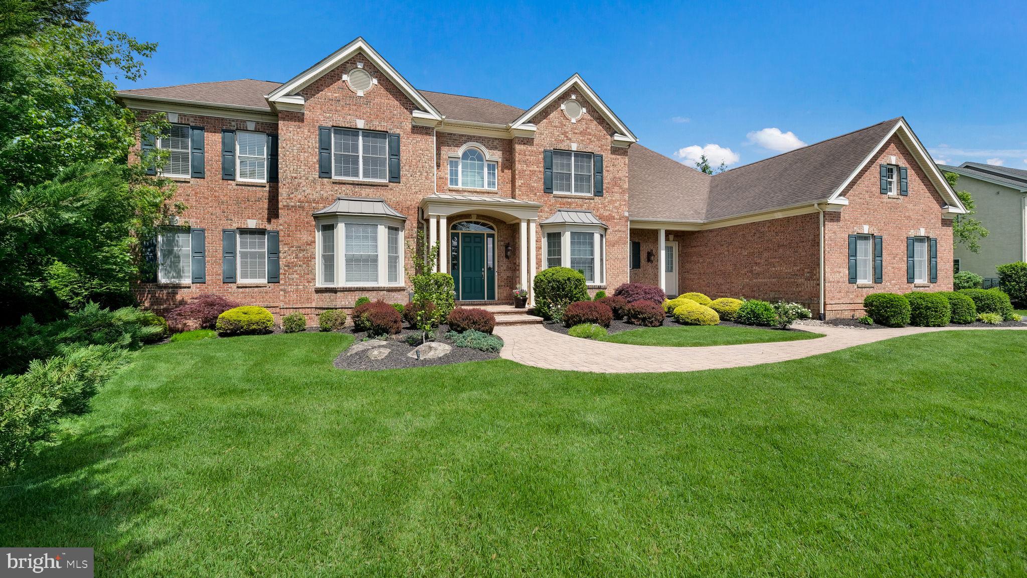 This exquisite Toll Brothers Chamberlain Model in prestigious Spring Valley Estates is better than ever! Recently refreshed with freshly painted rooms that brighten and modernize the interior, this home now offers an even more polished and inviting feel. Whether you're seeing it for the first time or returning for another look, you'll be captivated by the renewed charm and elegance that radiates throughout this estate. Don't miss this second chance to own a showstopper—schedule your tour and experience the new look today!
Perfectly situated in the heart of Buckingham Township and within the acclaimed Central Bucks School District, this 5 bedroom, 6.5 bathroom residence offers over an acre of luxurious living with an unmatched level of craftsmanship and detail. As you step through the front door, you're greeted by a grand foyer with soaring ceilings and a sweeping staircase that sets a tone of elegance and sophistication. Custom moldings and built-ins flow throughout the home, adding richness and architectural charm. The formal dining room and spacious living room, both designed with entertaining in mind, offer a warm welcome to guests. The living room features a cozy fireplace and opens into a bright and airy conservatory, adorned with tile flooring and expansive windows that overlook the beautifully landscaped backyard. The heart of the home is the gourmet eat-in kitchen, thoughtfully designed for both everyday living and hosting. This culinary space is equipped with upgraded appliances, custom cabinetry, and granite countertops, all beautifully accented by tile flooring. Just off the kitchen is the inviting family room, which features custom box beam ceilings, wood flooring, and a second fireplace that serves as the perfect focal point for gathering and relaxation. Beyond the family room, enjoy the study, with picturesque views of your backyard retreat. The finished lower level offers an impressive extension of the living space including an additional bedroom. Whether you're watching the big game or entertaining at the custom-built bar, this level delivers comfort, versatility and style. A dedicated area has been thoughtfully designed to accommodate a home gym - perfect for fitness routines, strength training or yoga. With a full bathroom and ample storage, the basement is as functional as it is inviting. Upstairs, the luxurious primary suite provides a peaceful retreat. This private sanctuary includes a charming sitting room, a generous walk-in closet, and a spa-inspired bathroom complete with dual vanities, a soaking tub, walk-in shower, and a separate water closet. Four additional bedrooms, each with their own en-suite bathrooms, offer privacy and space for family and guests alike. Step outside and discover your own personal resort. The meticulously landscaped backyard features a stunning custom pool and a fully outfitted pool house complete with a changing room, bathroom, and outdoor rinse-off area. Whether you're hosting a summer party or enjoying a quiet evening swim, this outdoor space offers the perfect escape. Located just minutes from the boutique shopping, fine dining, and cultural attractions of Doylestown and New Hope, and with easy access to Routes 202, 313, and 611, this home effortlessly blends luxury living with everyday convenience. Don’t miss your chance to own a masterpiece in one of Buckingham Township’s most prestigious and private communities. Schedule your private showing today.