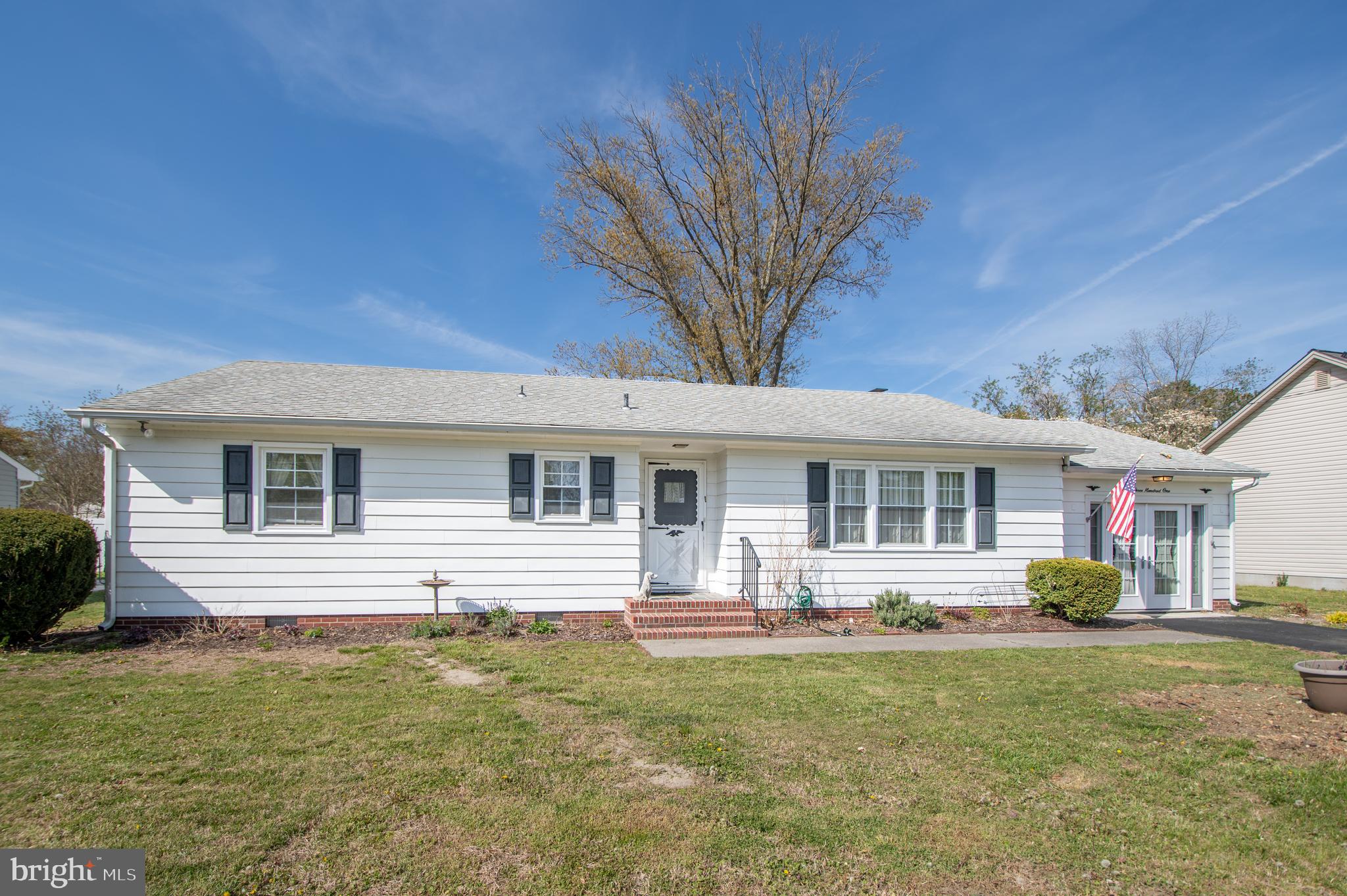 Welcome to this charming 2-bedroom, 1-bath rancher located just outside the town limits of Delmar, MD—offering the perfect balance of privacy and convenience. Step inside to a spacious living room filled with natural light from a large front window, creating a warm and inviting atmosphere. The formal dining room flows seamlessly into the kitchen, which features a newly installed window, making it ideal for everyday living and entertaining. Toward the rear of the home, you’ll find a utility room complete with washer and dryer, along with access to the backyard—perfect for relaxing or outdoor gatherings. A converted garage now serves as a versatile den, offering additional living space for a family room, office, or hobby area.
Additional highlights include a brand-new septic system, public water, a driveway sealed last summer, and recently painted door and shutters for added curb appeal. A great opportunity for comfortable, one-level living in a peaceful setting just minutes from town!