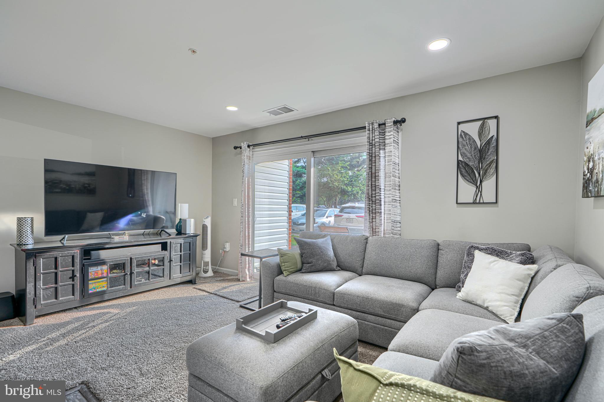 Welcome to 1210 Mist Wood Ct #104! This 2 bedroom ground floor condo is in Riverside Park in Belcamp. You can enter through the lobby front door or through the easily accessible patio sliding glass door into an open concept living area, that opens into the kitchen and formal dining area. The kitchen is has been remodeled with stainless steel appliances, custom cabinets and breakfast bar. Updated carpet throughout and a recently remodeled bathroom. Laundry room has updated cabinetry easy to store cleaning supplies.  The owners suite has its own entrance into the full bath and a walk in closet. The windows and sliding glass door are only a couple years old. This entire condo has been well maintained and taken care of. Sit and drink some coffee on the patio, join the neighborhood swimming pool, or play on the tennis courts. Very convenient to shopping, dining, I95 and APG. Condo fees cover trash, water and snow removal. Don't miss out on this home!