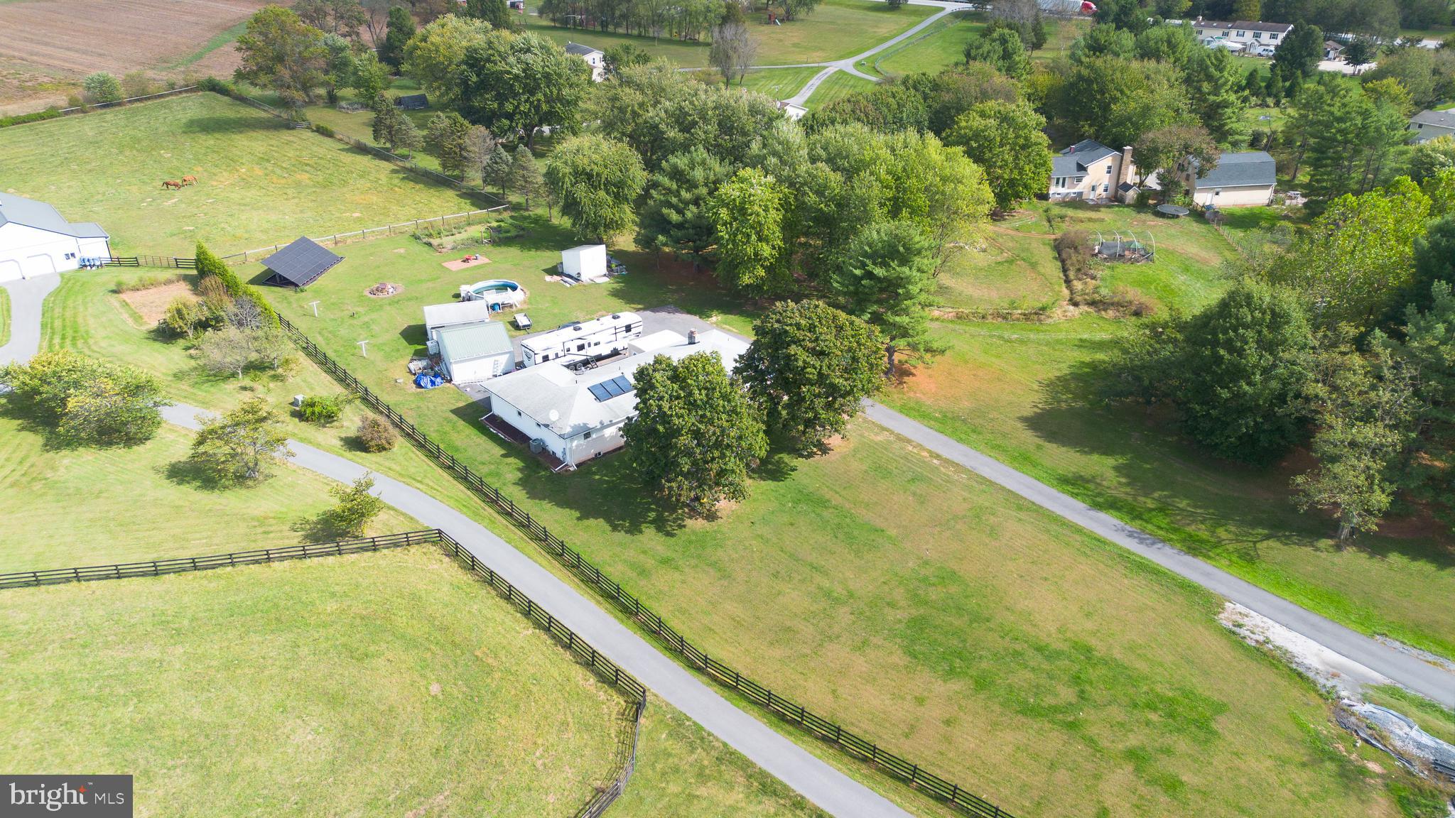 Opportunity is knocking on this amazing ranch-style home situated on 1.19 acres! The owner has updated the kitchen and made many thoughtful improvements, but a few finishing touches have been left for the new buyer to make their own. This energy-efficient home features $68,000 in owned solar panels- that’s right, NO LEASE and big savings on your electric bills! The partially finished basement offers an inviting family room with a pellet stove, perfect for cozy evenings. The upper level features a private owner’s suite on one side of the home and three additional bedrooms and a full bath on the other, offering an ideal layout for any lifestyle. Enjoy a spacious dining room and a living/family room with a second pellet stove. Don’t miss your chance to own this special home in a peaceful, private location and experience the best of comfort, efficiency, and space!