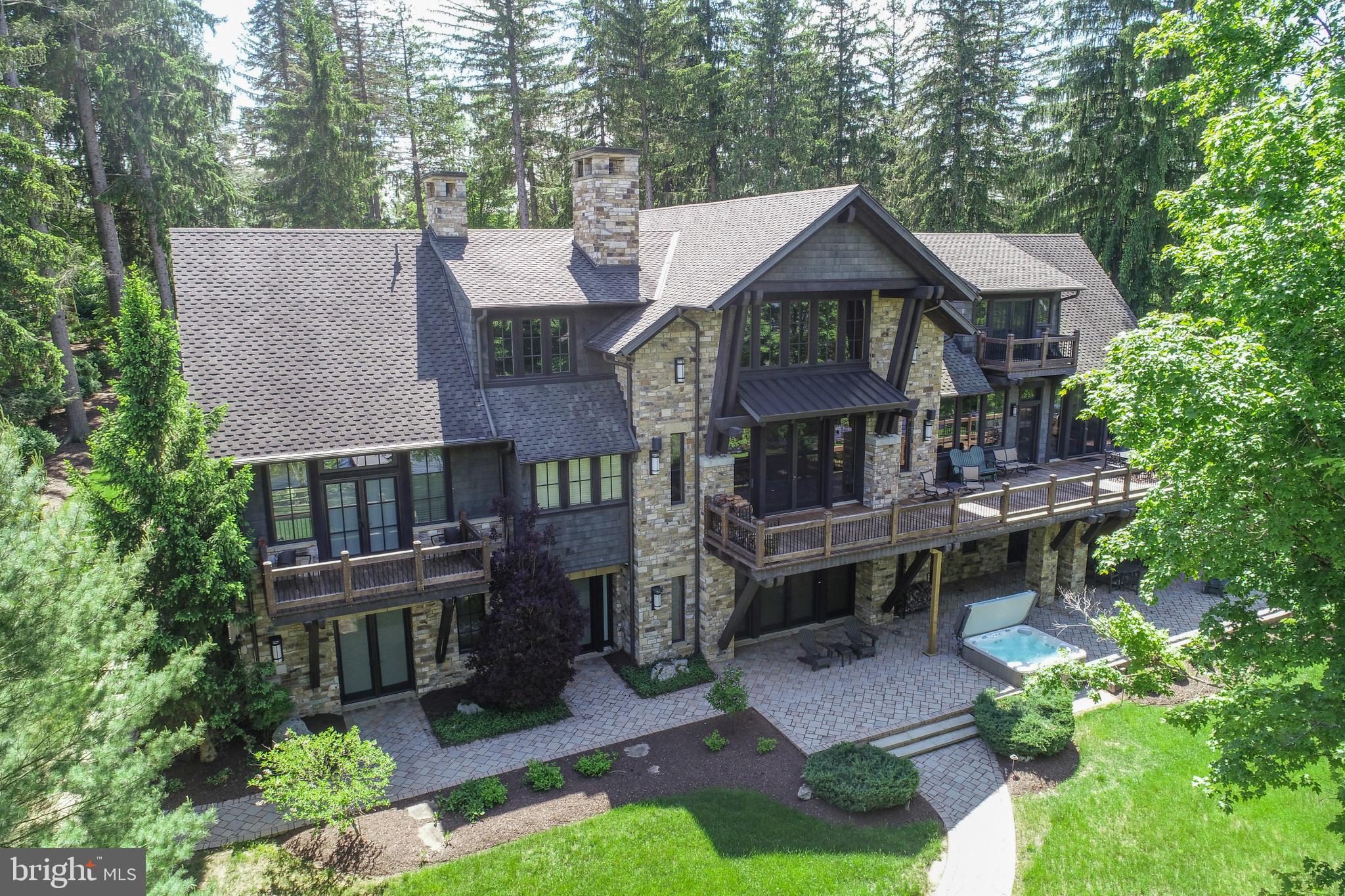 ICONIC. A design masterpiece of stone and timber — a true Rex Anderson build that reflects the seamless merging of inspiration and architecture. Warm, and undeniably welcoming, this home stands as a statement of craftsmanship and vision.
 
Discover a breathtaking blend of contemporary luxury and timeless timber frame construction, perfectly positioned for privacy within the prestigious Reserve at Holy Cross. Surrounded by soaring pines and set against the sparkling backdrop of Deep Creek Lake, this architectural gem offers a flawless fusion of indoor elegance and outdoor serenity.
 
Step inside to soaring exposed beam ceilings, floor-to-ceiling windows, and open, airy living spaces. The great room centers around a striking floor-to-ceiling stone fireplace, complemented by handcrafted timber details and expansive glass doors that open onto a sprawling lakeside deck. 
 
The chef’s kitchen is a modern centerpiece, featuring high-end appliances, granite countertops, custom cabinetry, and a generous island perfect for gathering with family and friends. The primary suite is a luxurious retreat, a spa-inspired ensuite, and dream walk-in closet. 
 
Throughout the home, no detail has been overlooked — from hardwood trim, solid wood doors, all of which, are hand-selected finishes that speak to quality and intention. Additional features include a fully equipped home gym and an energy-efficient geothermal system, ensuring sustainable comfort year-round.
 
Set on 1.3 acres with 160 feet of pristine waterfront, this exceptional property delivers both privacy and proximity to Deep Creek Lake’s finest amenities — from boating and skiing to dining and golf.
 
This is more than a home. It’s a lifestyle. A statement. Welcome to your lakefront legacy.