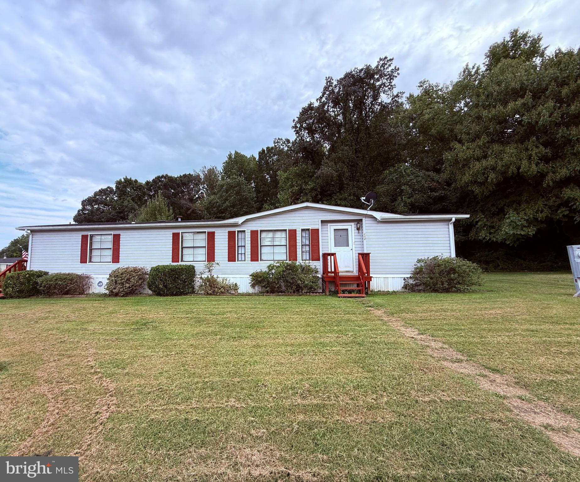 HUGE PRICE REDUCTION ! WELL MAINTAINED, DOUBLE WIDE IN QUIET, COUNTRY & WATER ORIENTED BUSH RIVER MANOR. BEST LOT IN THE NEIGHBORHOOD WITH A HUGE PRIVATE YARD THAT BACKS TO WOODS. ACCESS TO WALKING TRAILS NEAR A WILDLIFE ESTUARY. NEWER FURNACE (2014), NEW STAINLESS STOVE, NEWER REFRIGERATOR. EXPANSIVE DECK WITH RETRACTABLE AWNING. SHED $943/MONTH LOT RENT PLUS $203.04/YEAR TAX INCLUDES TAXES, SNOW REMOVAL, TRASH SERVICE, PLAYGROUND, BASKETBALL HOOP, DECORATIVE STREET LIGHTS . 600 OR HIGHER CREDIT SCORE REQUIREMENT. ***A plumbing leak in the bathroom has been repaired, however flooring has been removed and will not be replaced. House is being sold as is. Make an offer!