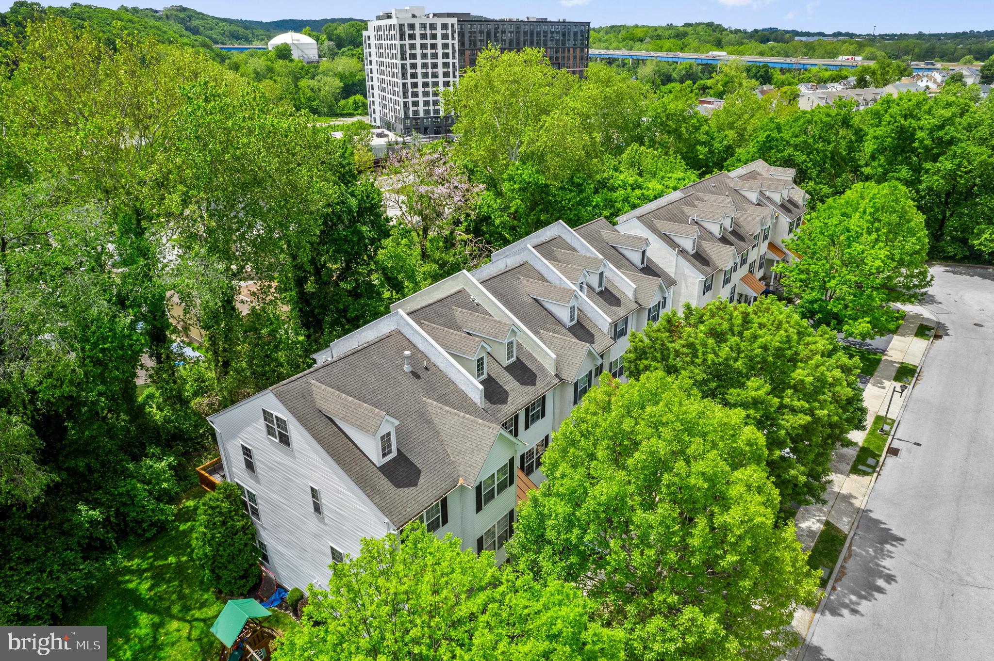 On a quiet cul-de-sac, surrounded by mature trees, you'll find a private enclave neighborhood called Shannons Way.  This 3-story townhome + finished walk-out basement provides all of the space and versatility that your family needs. The best part? A refresh renovation will be completed for you before move-in! This includes the kitchen cabinets being refinished to white if desired, gray luxury vinyl plank flooring in the kitchen, hallway, and half bath to match the rest of the house, entryway stairs refinished, and the ENTIRE home freshly painted for you (walls, ceilings, doors, & trim!).  The exterior of the home has already been power washed and painted.  The main floor features an open floor plan with living room, dining area, kitchen with breakfast nook, and a convenient half bath.  The living room is big enough for your favorite furniture, with peaceful views of the surrounding trees, and a gas fireplace to anchor the space.   A large deck is the perfect place to grill & relax in the upcoming warmer months.  The kitchen, which will receive an update before settlement, has a nice layout and enough room to add a coffee bar, bakers rack, or movable island.  The picture frame pass through makes it open to the living room/dining area, and could easily be turned into a breakfast bar for extra seating.  Solid maple cabinetry, stainless steel appliances, and granite countertops add to the appeal.  Head upstairs to the 2nd floor where you'll find the Primary Suite, and bedroom #2 with a full hall bathroom.  The Primary Suite has soaring views from the large windows, vaulted ceilings, and an en-suite bathroom.  The 3rd floor is where you'll find the spacious bedroom #3, which would also make a great hobby room or office. The finished walk-out basement has bedroom #4, with an en-suite full bathroom and private entrance to the backyard.  This could be great for guests, extended family, au-pair, or in-law suite because there is a ground floor entrance from the garage.  This home is safely situated at the end of the street, with no thru traffic, and cul-de-sacs on both ends of the street - a great place to play outdoors worry-free.  Within walking distance to downtown Conshohocken restaurants, shops, parks, and events.  Enjoy close proximity to the Schuylkill River Trail and SEPTA train.   303 W. 1st Avenue is a welcoming and peaceful place to call home - schedule a private tour today-
