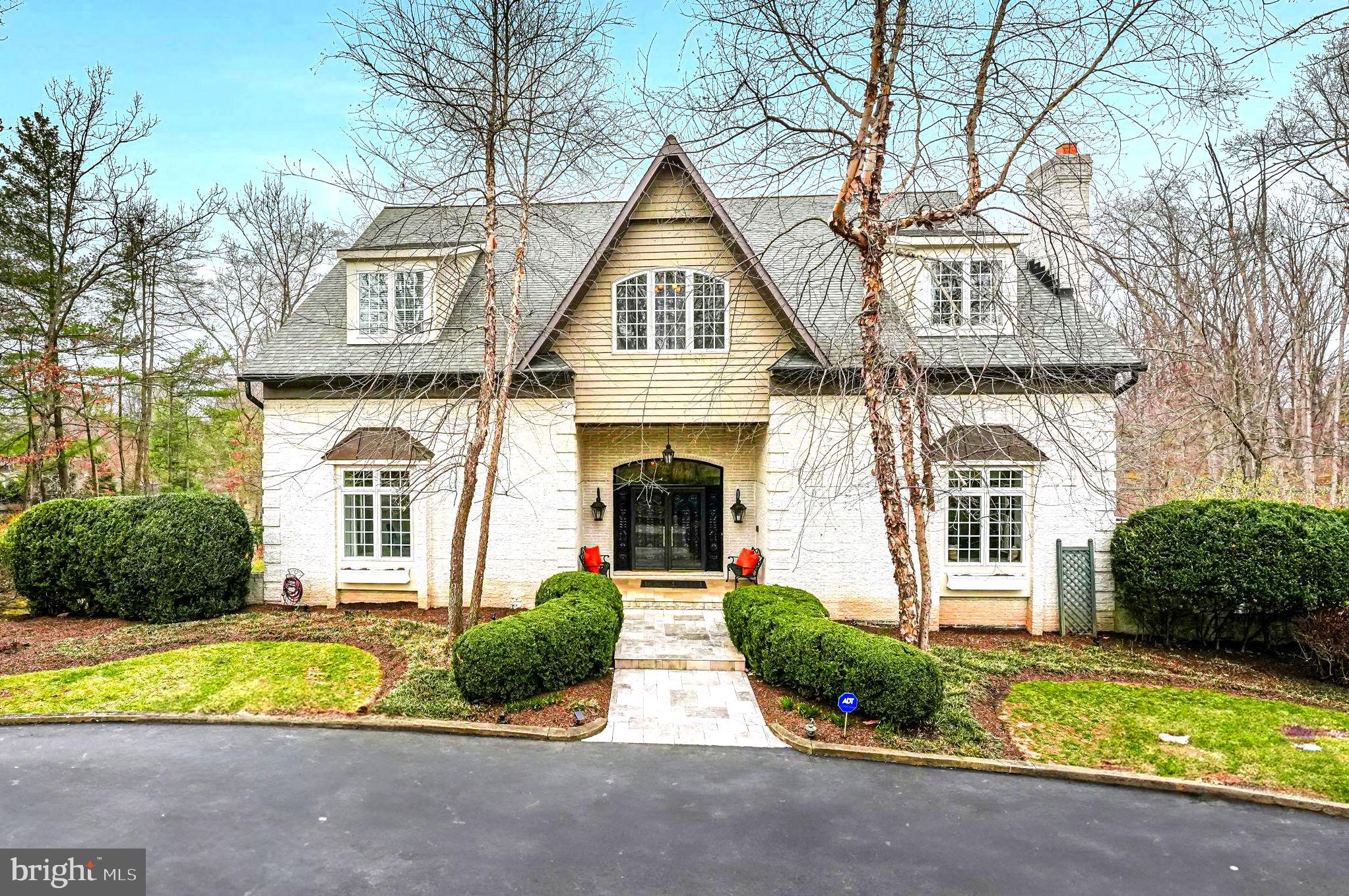 OPEN HOUSE CANCELLED!   
Welcome to an extraordinary residence located at 10500 Walter Thompson Drive, nestled in a lovely neighborhood known for its equestrian charm. This distinguished property, greets you with a circular driveway and covered porch, offering 7,390 square feet of refined living space. Set on 2.2 acres , it provides both privacy and convenient access to the vibrant town of Vienna!

As you step through the handcrafted mahogany doors into the grand foyer, you're greeted by an impressive 14-foot ceiling that envelops you in the grace and sophistication of this home. Elegantly appointed with Clive Christian built-in cabinetry and intricately detailed plaster cornice moldings, tall windows, the residence offers an incredible flow and use of space, ideal for both everyday living and hosting gatherings.

The main level, with its 10-foot ceilings, features formal living room w/ fireplace, family room and spacious dining room with views and access to the extensive deck. Additionally there is a wonderful library that can serve as a main-level bedroom with full bath. The exquisite gourmet kitchen is outfitted with Clive Christian cabinetry, an island with teak countertop, Ogee edge granite, 60' Wolf gas stove, French top & grill, two full size ovens, Miele dishwasher and steam oven and Sub Zero refrigerator. A custom, built-in spice pantry with Carrara marble top, fluted front sink and second sink as well as a Butler's station with wine cooler and access to the delightful morning deck and rear staircase. The morning room includes a hand carved intricate detailed fireplace, bench window seat and built-in cabinetry perfect for everyday meals and morning quiet coffee!

The upper level with 9' ceilings, serves as a private retreat, showcasing a luxurious primary bedroom suite with generous walk-in closets, additonal built-in Clive Christian cabinetry, a sitting area, and a wonderful spa-like bathroom. Additionally, two expansive bedroom suites share a beautifully appointed bathroom, and a convenient laundry room adds to the home's practicality.

The inviting walk-out lower level with 10 ft ceilings, is thoughtfully designed to enhance versatility, offering an ideal space for entertaining, relaxing and everyday living: featuring three additional bedrooms, one currently used as a gym, along with three full bathrooms. A recreation room with a curved fireplace, a full wet bar, a second laundry room, and a storage pantry enhance the home's functionality, with two staircases providing access to the main level.

Outdoors, the property boasts a fully fenced swimming pool, a flowering trellis patio, and a play area. The stunning landscaping and mature trees frame this unique property, offering a serene escape. This distinguished neighborhood offers outdoor enthusiasts direct access to miles of trails that are a part of the Fairfax County Connector trail, perfect for hiking, biking, and exploring nature.

Experience the timeless elegance and exceptional craftsmanship that define this home. Additionally, it lies in the Madison HS Pyramid and just minutes to the Town of Vienna! Schedule a showing today!
