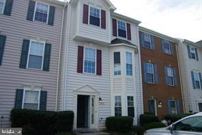 Professional photos coming soon!! 3 finished levels with open huge living room & eat in kitchen. Deck is off of the kitchen and backs to common area. Newer carpet, lower level with rec room, full bath & bedroom. Primary suite boasts private bath with joint walk in closets. 2 assigned parking spots + a visitor pass!