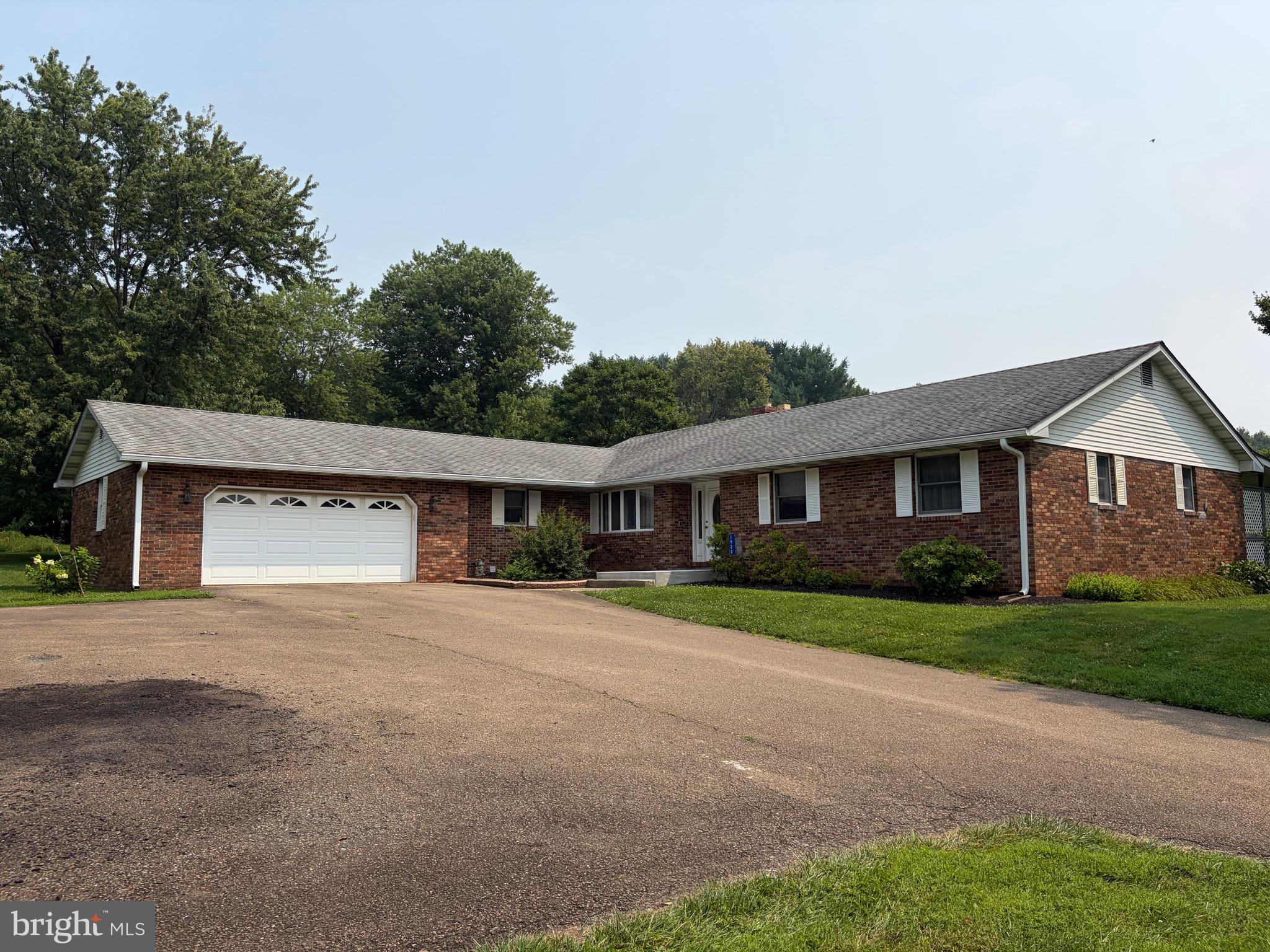 What a great home!  This custom built brick rancher sits on just under 6 acres and offers over 2000 sf of living space. Features include 3 bedrooms and 2.5 baths, The owners suite has a walk-in closet, en suite bath. and sliders to a rear deck. Most of the main level has hardwoods.  The sunken-in family room has a wood burning fireplace. The kitchen has cherry cabinets and corian counters. There is a separate dining room and a den.  The two car garage has access to a large mud room just off the kitchen. The property is nice and open, leaving plenty of space for gardens, a pole barn, or a swimming pool!  Rising Sun School District (buyer to verify). ***Professional photos will be take on Thursday July 23 and will be posted on July 24***