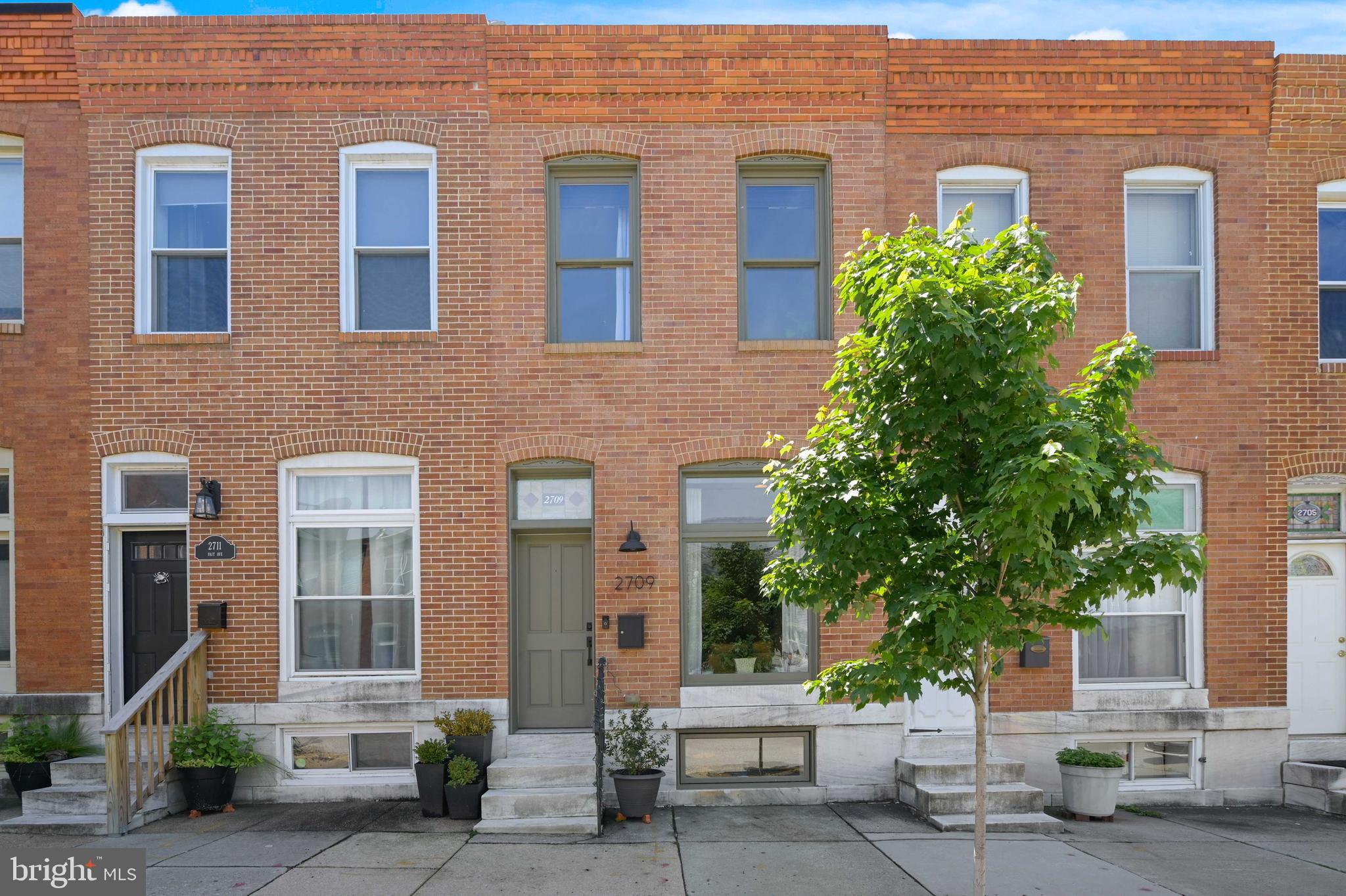 Gorgeous fully renovated 3 bedroom, 3 full bath home with parking pad in the heart of Canton! Open floor plan with exposed brick, stained glass transom, recessed lighting, dining area, hardwood floors, kitchen island with pendant lights, white cabinets, quartz counters and stainless steel refrigerator. Upper level with skylight and transoms above doors, hall bath with stand up shower, primary bedroom with en suite bath with whirlpool tub, second bedroom with door to lower deck and an amazing rooftop deck! This is the only home on the block with a rooftop deck so it is very private.  Lower level is fully finished with a bedroom, full bath, additional living space and new washer and dryer. All levels, including the basement,  have high ceilings through out. Schedule a tour today!