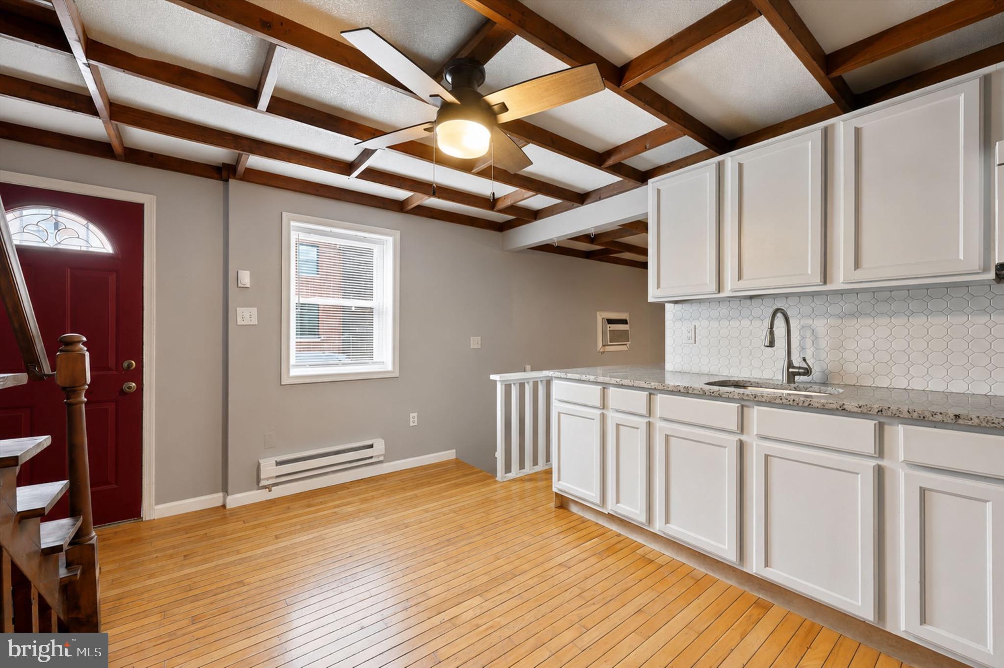 Welcome to the heart of Passyunk Square, one of the most desirable neighborhoods in the entire city.  This thoughtfully updated 2-bedroom, 1-bath corner-unit is just steps from East Passyunk Avenue’s renowned restaurants, cafés, and neighborhood favorites. Inside, classic South Philadelphia charm meets modern style with hardwood floors, soaring ceilings, and an open main level designed for comfortable everyday living and entertaining. The renovated kitchen features stone countertops, updated cabinetry, and a distinctive wood-accent ceiling that adds warmth and character. Upstairs, both bedrooms feel bright and spacious thanks to their impressive ceiling height and recent lighting updates, while the remodeled bathroom offers a sleek walk-in shower with contemporary finishes. A finished basement provides valuable bonus space for a home office, gym, media room, or play area, and a brand-new washer, dryer, and hot water heater add everyday convenience. With easy access to the Broad Street Line, Center City, major highways, parks, and some of Philadelphia’s best dining and shopping, this unique home is an exceptional opportunity to enjoy everything Passyunk Square has to offer. Listing contains some virtually staged photos.