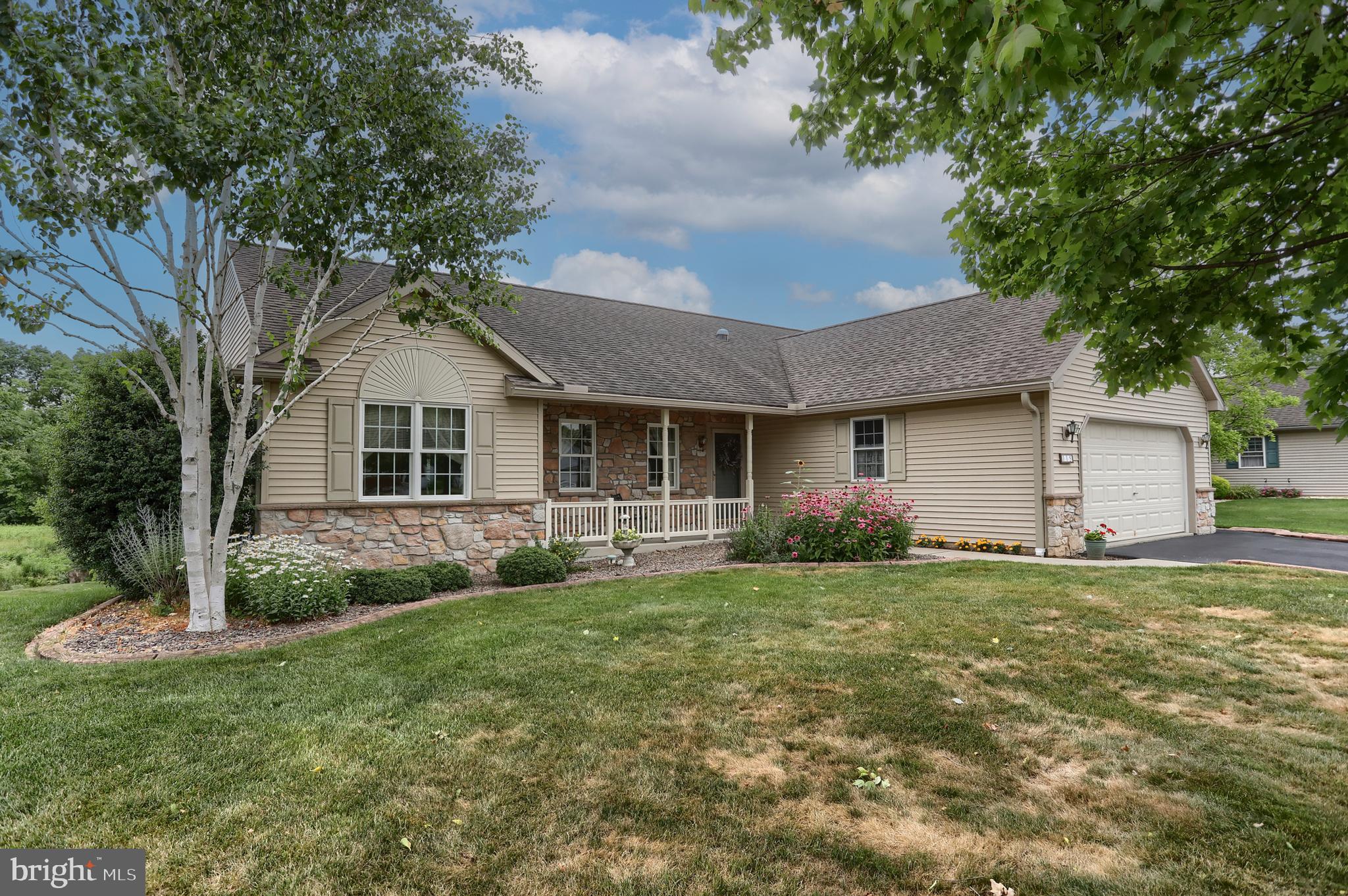 Timeless, classic, and elegant are the words that best describe 115 Arbor Drive.   From the birch tree, stone on the porch, coneflower, zinnias, blooming shasta daisy, neutral tones throughout, and the lovely back yard view, this home is sure to impress.  Step inside to discover an inviting open floor plan, enhanced by natural light and solar tubes. The living room and dining area are seamless.  Perfect for entertaining. The eat-in kitchen has beautiful cabinetry, complete with a pantry,  tile backsplash, purified water drinking tap, recessed lighting, sun tube, and custom-built pull-out interior shelving, and more inviting culinary creativity. Enjoy birdwatching through the large Andersen windows in the attractive four-seasons room.   Or retreat to the primary suite featuring a walk-in closet and a well-appointed en-suite with double sink, vanity, and convenient step in shower.  Nearby, you'll find the well-placed laundry room with a front-loading washer and dryer, a utility sink, and natural light provided by a sun tube.  The opposite side of the home offers 2 additional bedrooms and a full bath with tub/shower.  No need to downsize at 115 Arbor.  This home features a full walkout basement, with workshop, free standing shelving, and an additional room with a wide exterior door.  This room would be a great place to store garden tools. The exterior boasts low-maintenance stone and vinyl siding. Complemented by the oversized patio, deck, and a front porch perfect for outdoor relaxation and entertaining.  The attached two-car garage provides convenience.  NOTABLE FEATURES:  Andersen windows, updated flooring in kitchen, foyer, and hallway.  Larger-capacity spouting installed (2023). HVAC ducts and dryer venting cleaned (2022).  Bruno chairlift to lower level (2023).  Bosch dishwasher (2018), washer/dryer (2021), house pressure washed (2023), Gas hot water heater (2018), perfect edge concrete edging, reverse osmosis system,  Roof and skylight added over deck.  ABOUT THE NEIGHBORHOOD: Arbor Gate boasts excellent neighborhood features: lovely, picturesque tree-lined streets, sidewalks, attractive front porches, and street lights ensuring a safe, tranquil environment. As a resident of the Arbor Gate 55+ community, you’ll have access to amenities such as the Lakeview Clubhouse with a fitness room, coffee shop, library, billiards room, game room, weekly clubs, and annual events, fostering a sense of connection and engagement. The monthly land lease for 115 Arbor Drive starts at $638.34 per month and includes: land taxes, on-site management, sewer, trash collection, bi-weekly recycling, access to Lakeview Clubhouse, common areas, and community lake. Schedule your tour today! Don’t miss this opportunity to enjoy a fulfilling 55+ active adult lifestyle in a welcoming community. Experience a lifestyle of comfort and connection at 115 Arbor Drive, where every detail is designed to meet your needs.