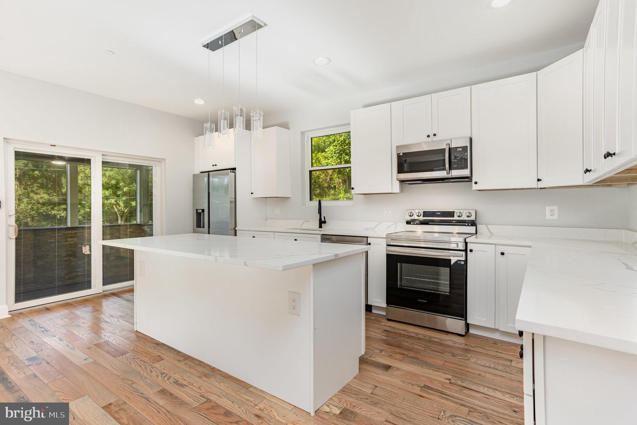 NEW CONSTRUCTION in Parkton! Welcome to 2430 Harris Mill Rd. This beautifully crafted home offers over 2,700 sq ft of finished living space on a spacious 1+ acre lot. Featuring 4 bedrooms and 4.5 baths, this home includes two primary suites (one on each floor), providing flexibility for a first-floor family room or den. Highlights include a well-appointed kitchen, elegant bathrooms, gleaming hardwood floors on the main and upper levels, and a finished basement with full bath. Outdoor amenities include a covered front porch, an additional screened-in porch with grill, a spacious patio and large yard. Driveway easement on property.